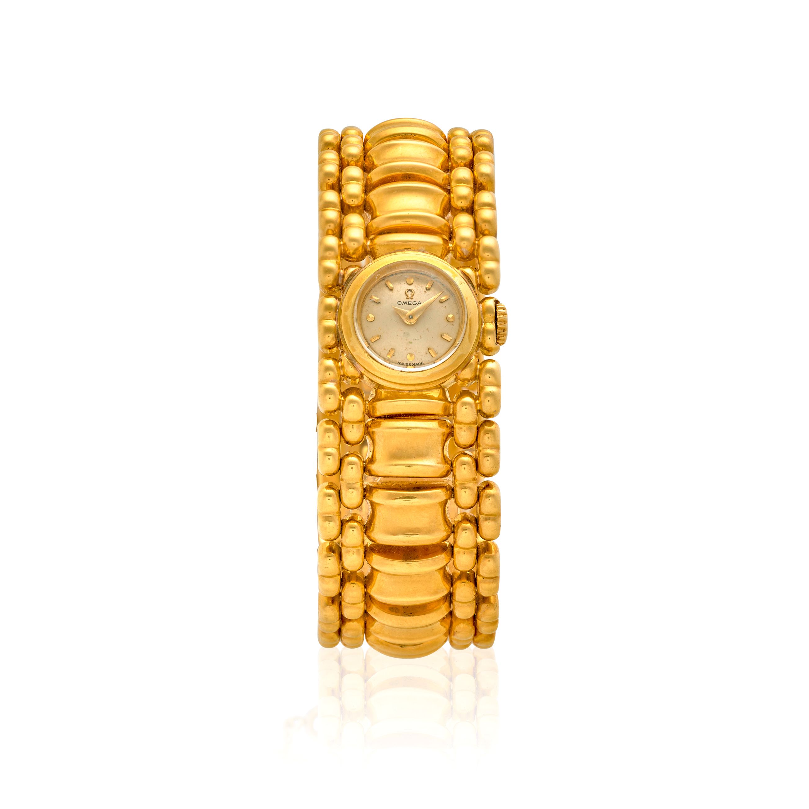 OMEGA. A LADY'S 18K GOLD MANUAL WIND BRACELET WATCH Post Retro,
