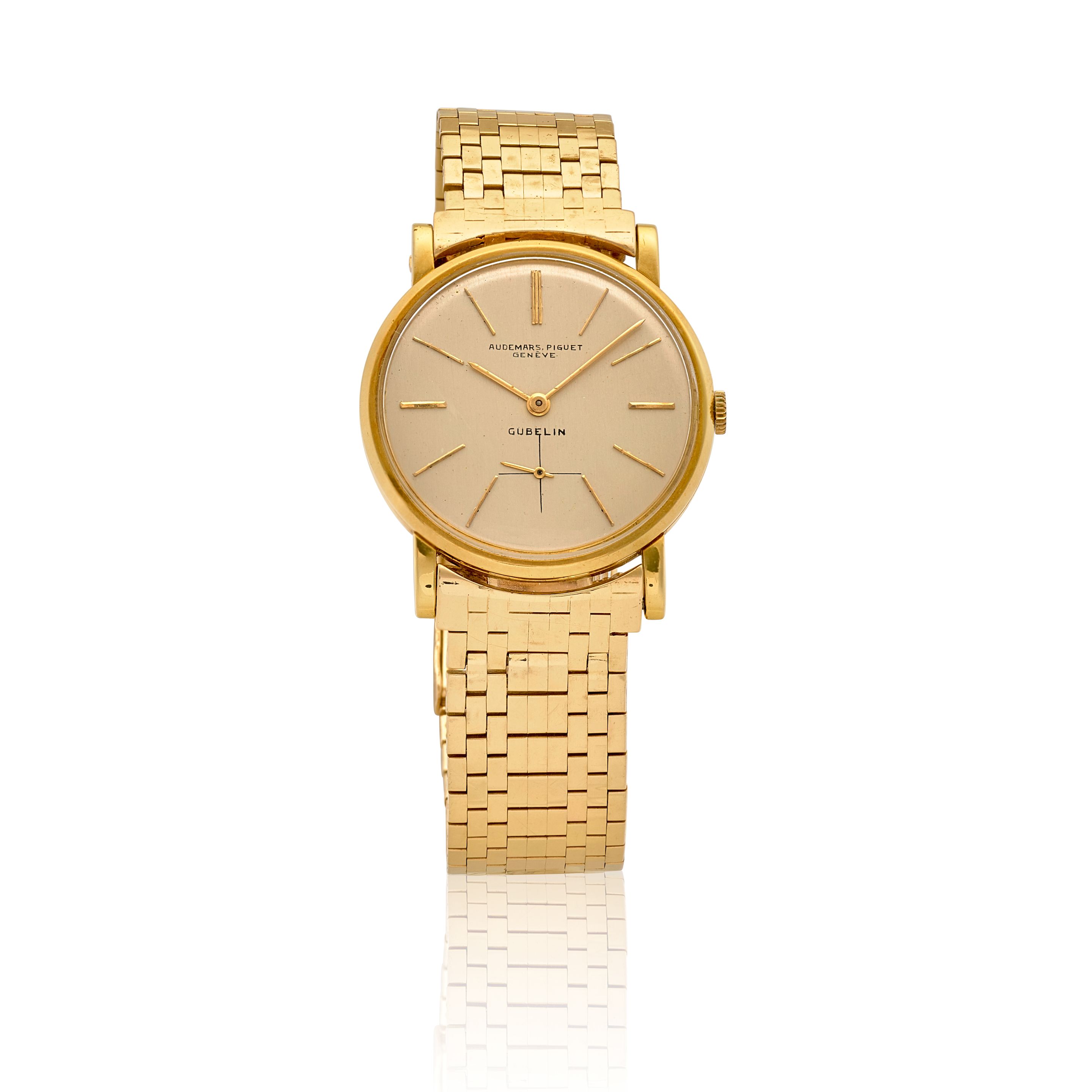 AUDEMARS PIGUET. AN 18K GOLD MANUAL WIND BRACELET WATCH RETAILED BY GÜBELINc.1950s