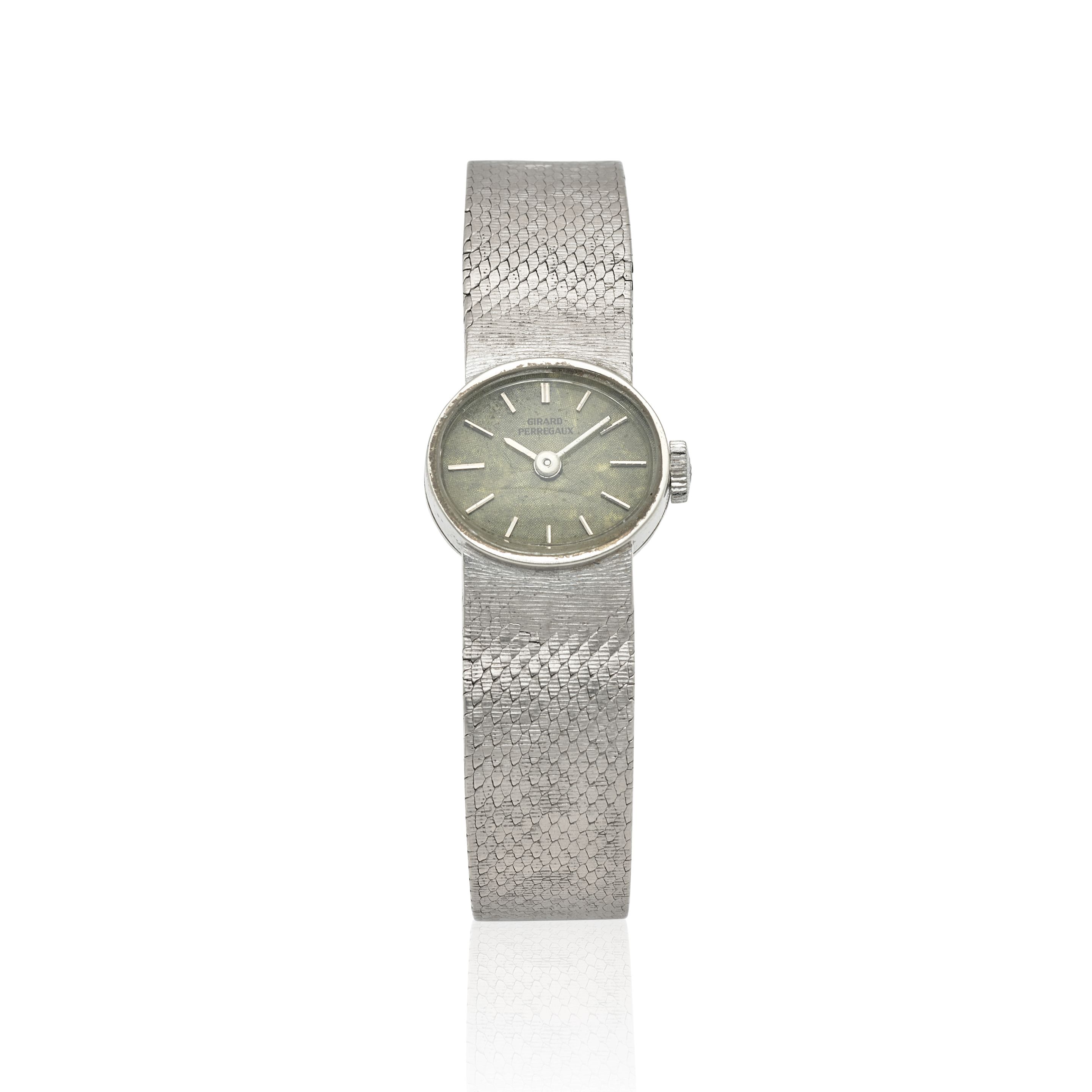 GIRARD PERREGAUX. A LADY'S 18K WHITE GOLD MANUAL WIND BRACELET WATCH Purchased 19th October, 1973
