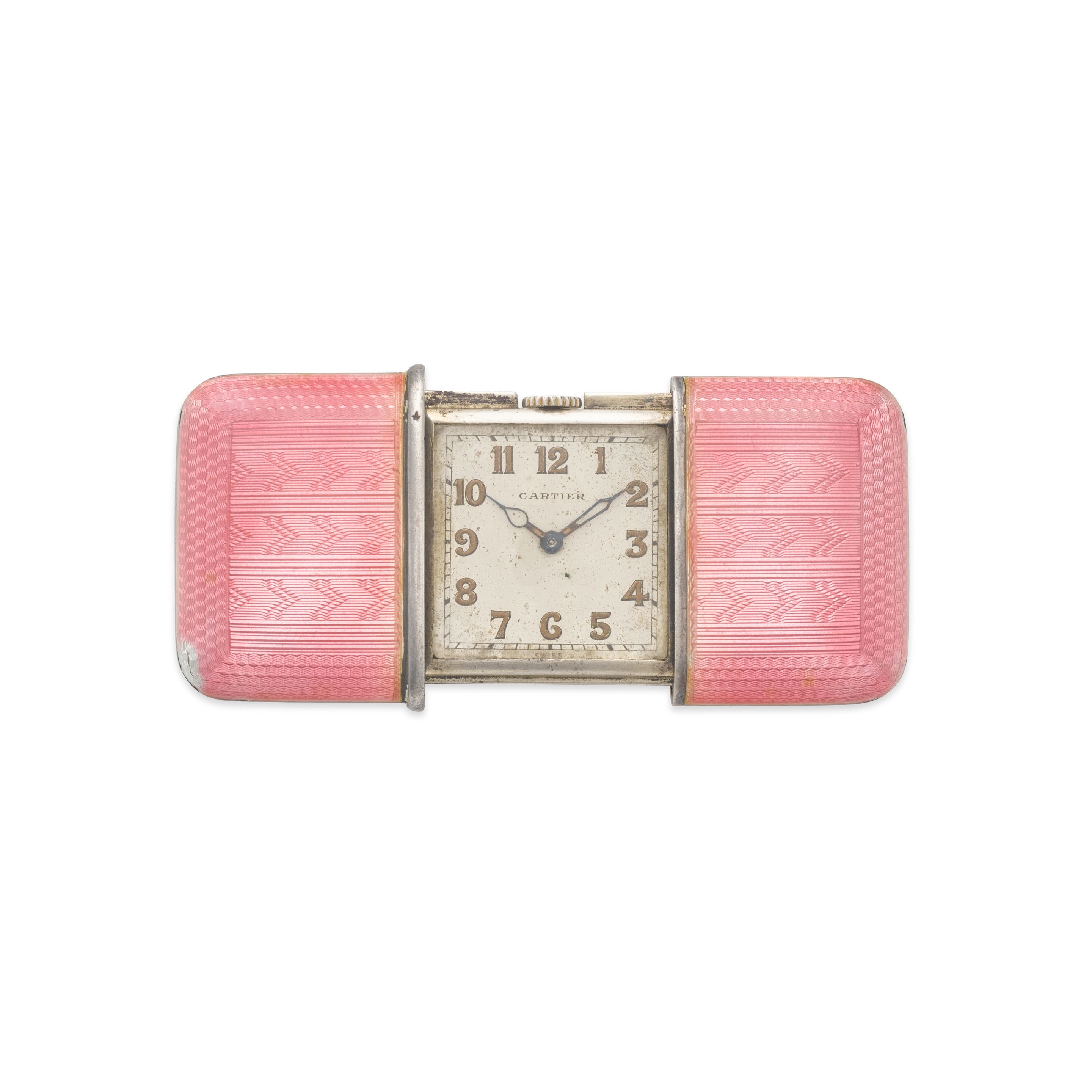 CARTIER. A RARE STERLING SILVER AND ENAMEL CONCEALED TRAVEL WATCH1930