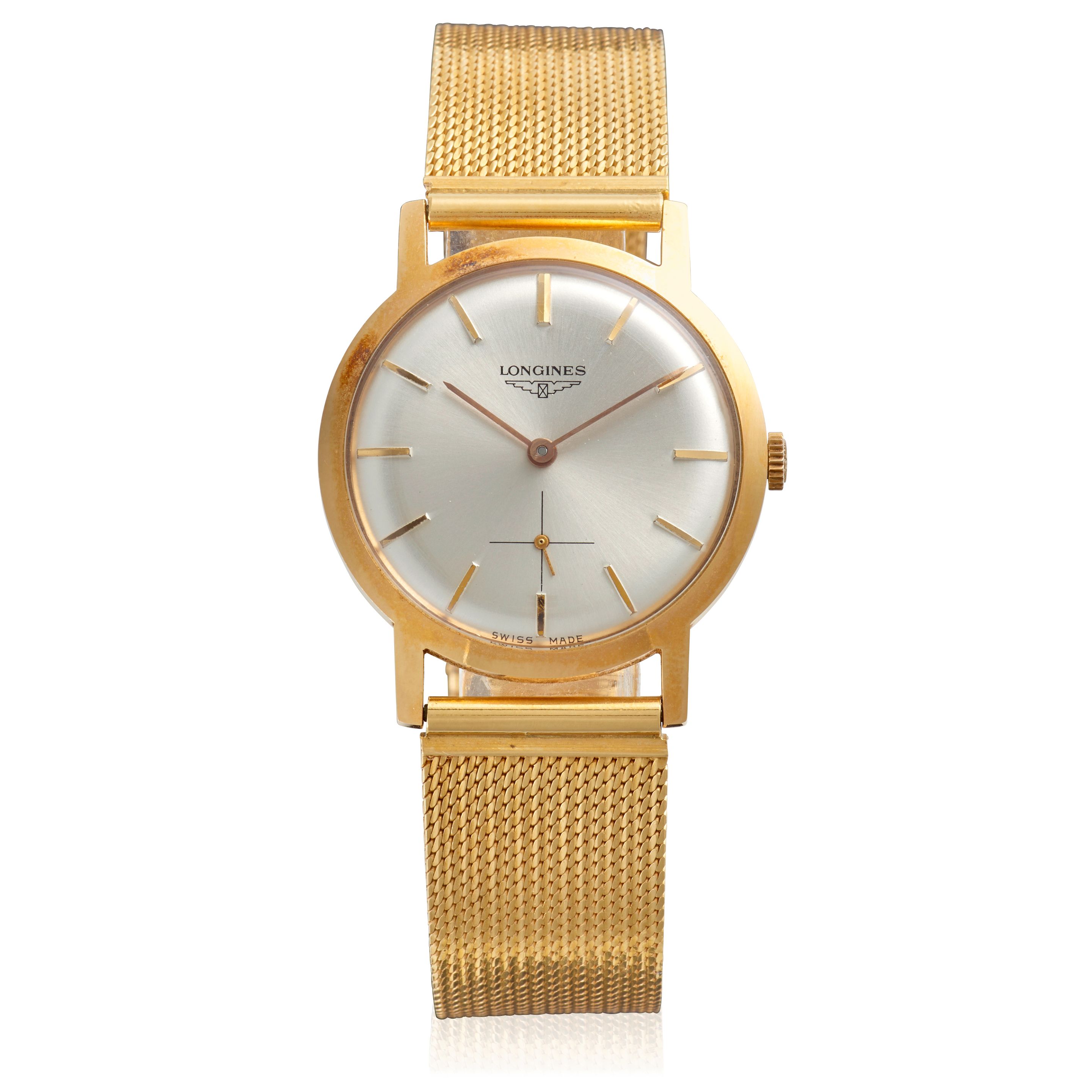 LONGINES. AN 18K GOLD MANUAL WIND BRACELET WATCH