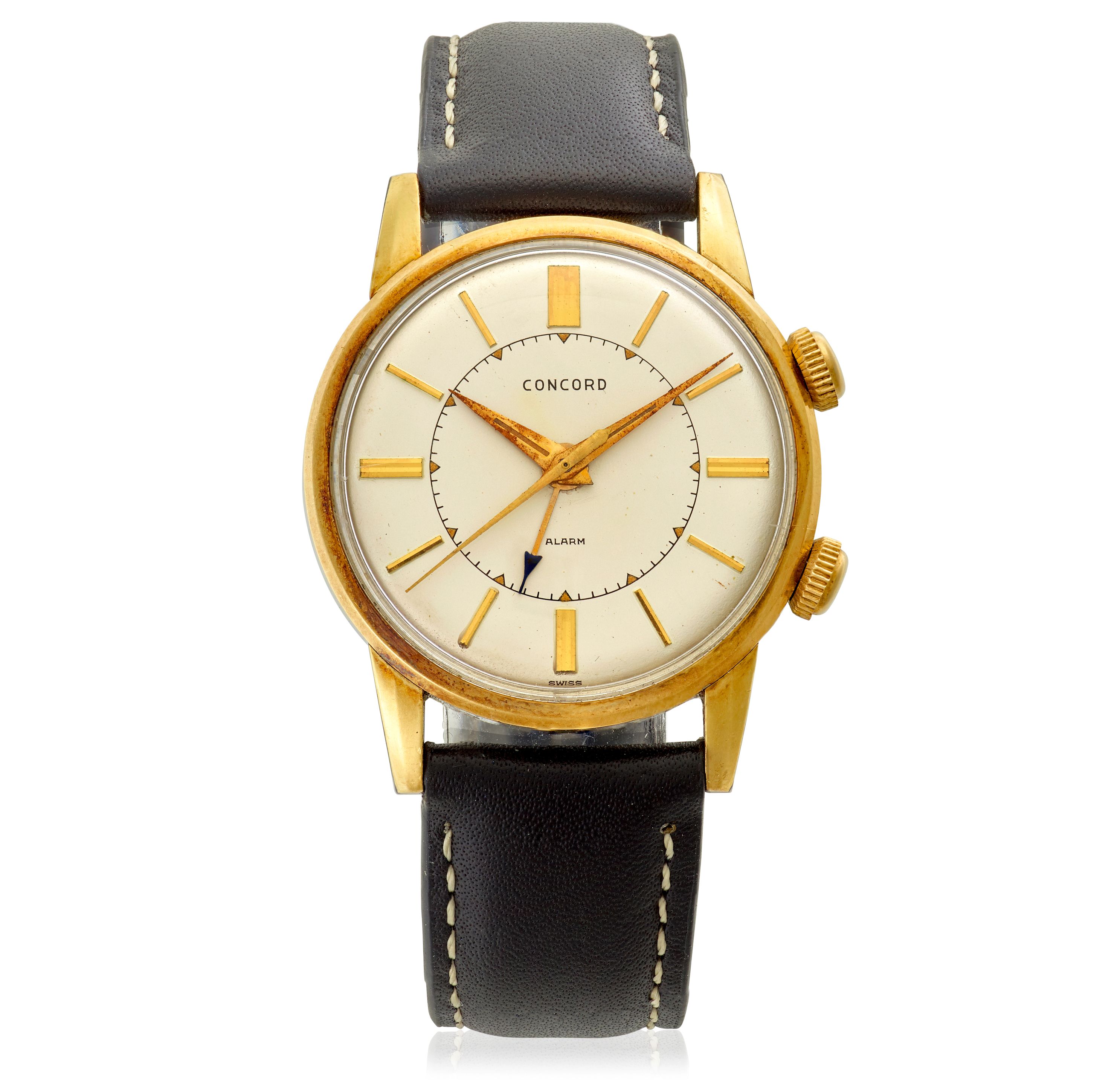 CONCORD. A 14K GOLD AND STEEL MANUAL WIND ALARM WRISTWATCH Alarm,