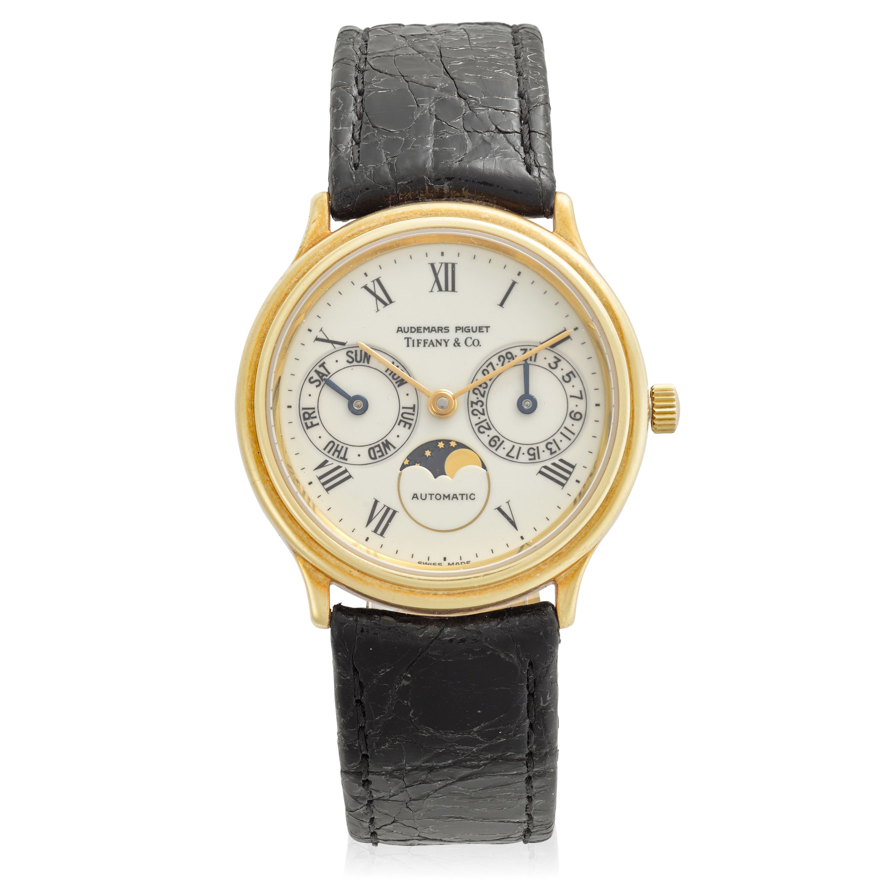 AUDEMARS PIGUET. A RARE 'TIFFANY' SIGNED 18K GOLD AUTOMATIC CALENDAR WRISTWATCH WITH MOON PHASERef: 25589BA, c.1980s