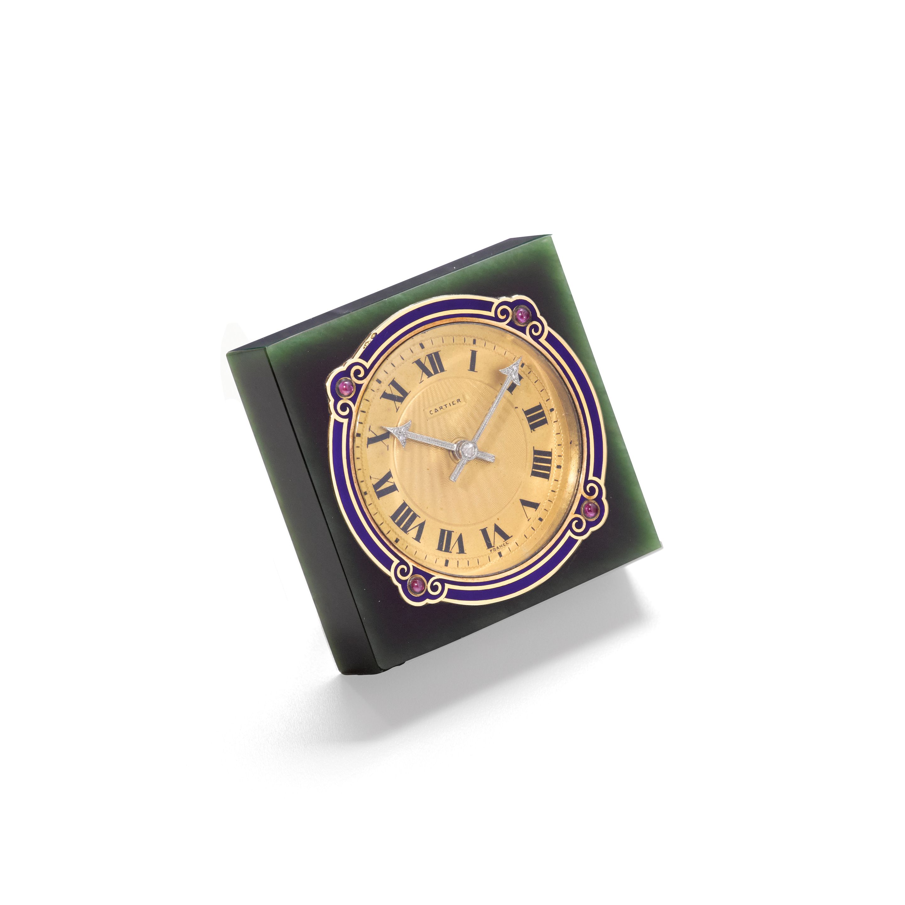CARTIER. A FINE ENAMELED GOLD AND RUBY MOUNTED NEPHRITE DESK TIMEPIECE1920's