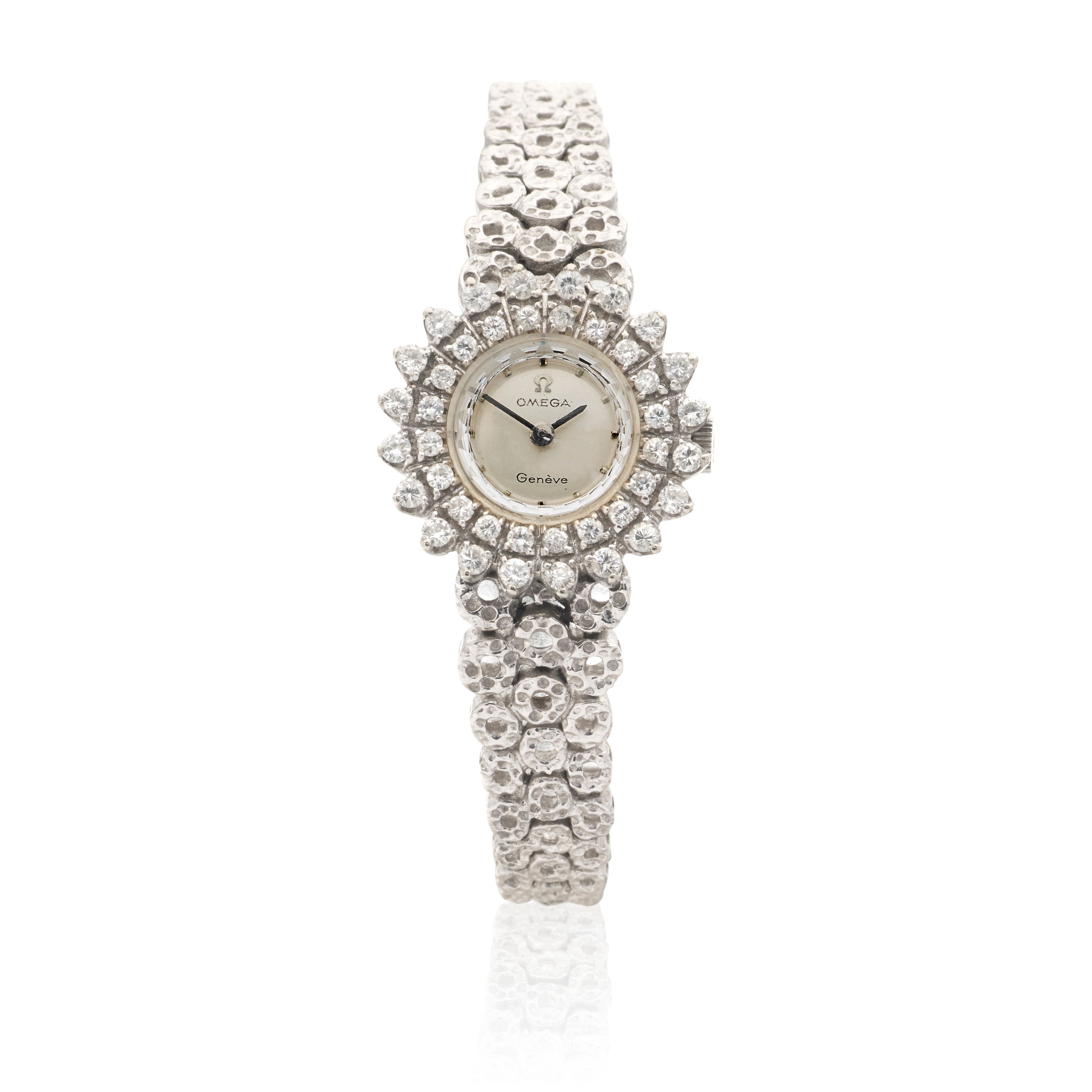 Omega. A lady's 18K white gold and diamond set manual wind bracelet watch Circa 1970