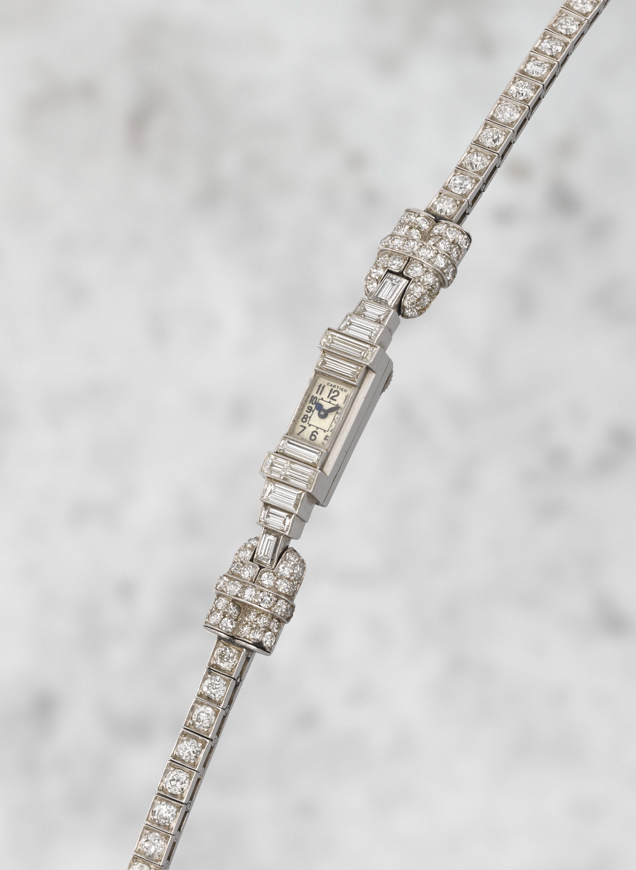 Cartier. A lady's rare platinum and diamond set manual wind bracelet watch offered on behalf of the family of the original owner Circa 1930