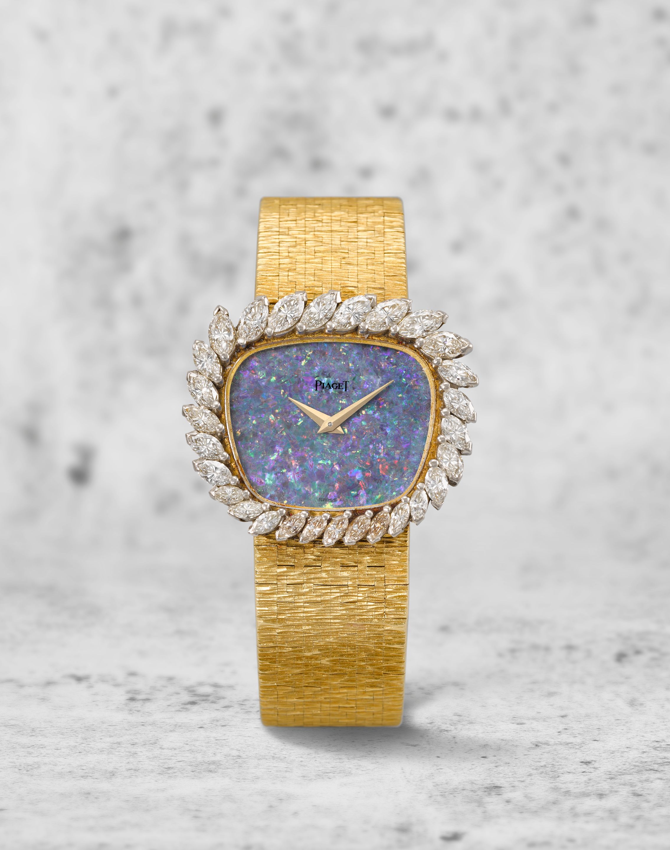 Piaget. A lady's 18K gold and diamond set manual wind bracelet watch with opal dial offered on behalf of the original family Ref: 9482 A ...