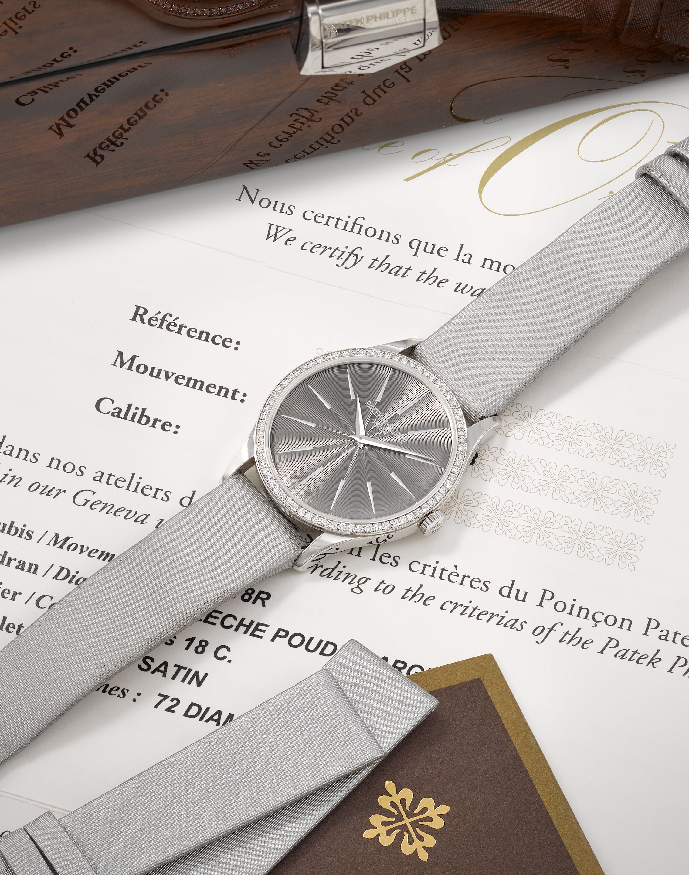 Patek Philippe. A fine lady's 18K white gold diamond set manual wind wristwatch Calatrava, Ref: 4897G-010, Purchased 5th October 2016
