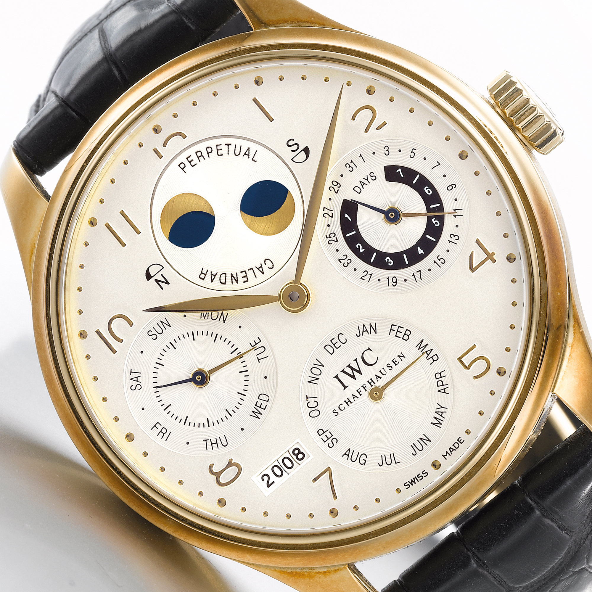 International Watch Co., AN OVERSIZED YELLOW GOLD AUTOMATIC PERPETUAL CALENDAR WRISTWATCH WITH MOON-PHASES, YEAR AND 7-DAYS POWER RESERVE INDICATION CIRCA 2003 PORTUGUESE PERPETUAL CALENDAR