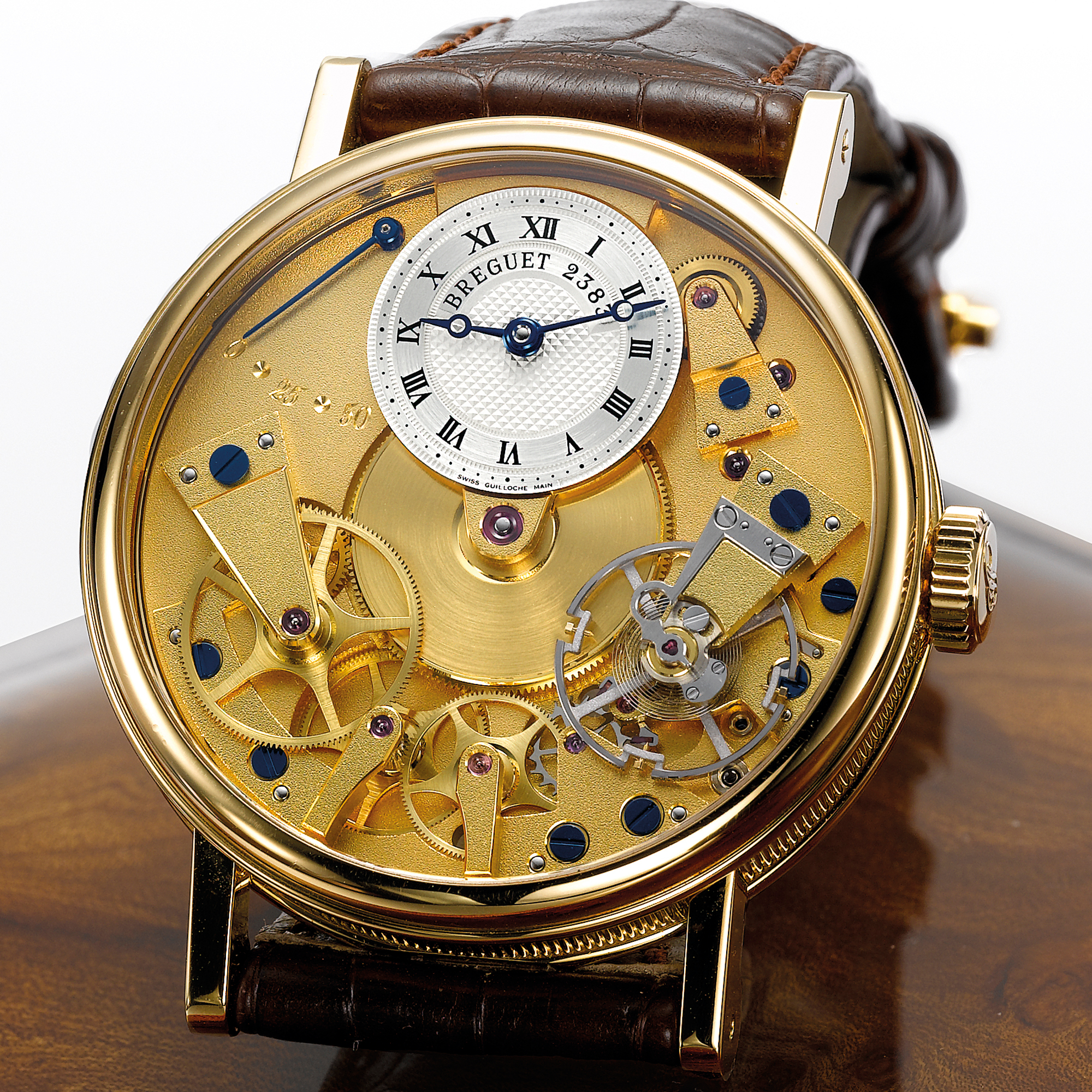 Breguet, A YELLOW GOLD SEMI-SKELETONISED WRISTWATCH WITH POWER RESERVE INDICATION CIRCA 2005 REF 7027 LA TRADITION NO 2383