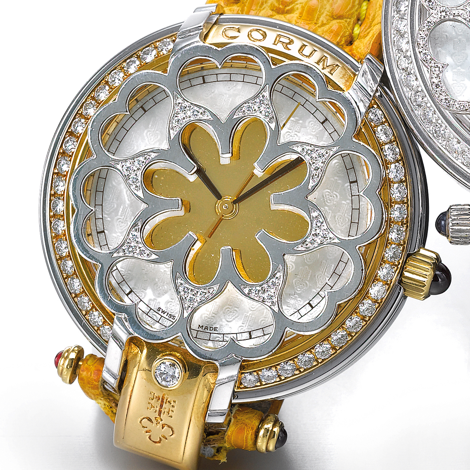 Corum, A LADY'S TWO COLOR GOLD AND DIAMOND SET AUTOMATIC WRISTWATCH WITH ENGRAVED MOTHER-OF-PEARL AND GILT DIAL CIRCA 2005 