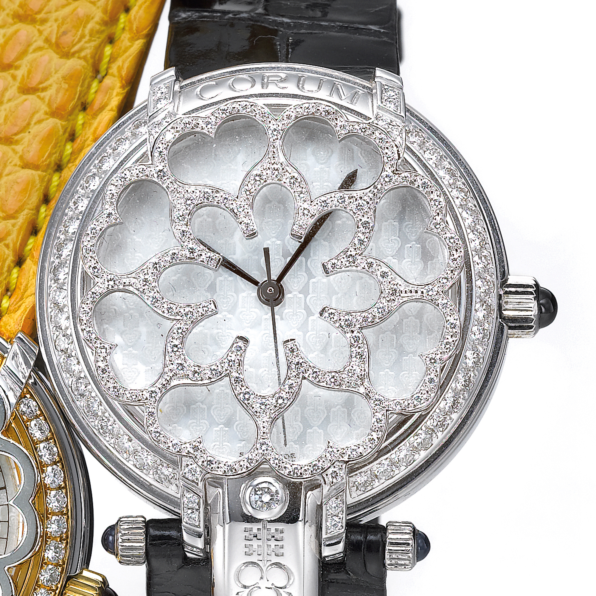 Corum, A LADY'S WHITE GOLD AND DIAMOND SET AUTOMATIC WRISTWATCH WITH ENGRAVED MOTHER-OF-PEARL DIAL CIRCA 2005