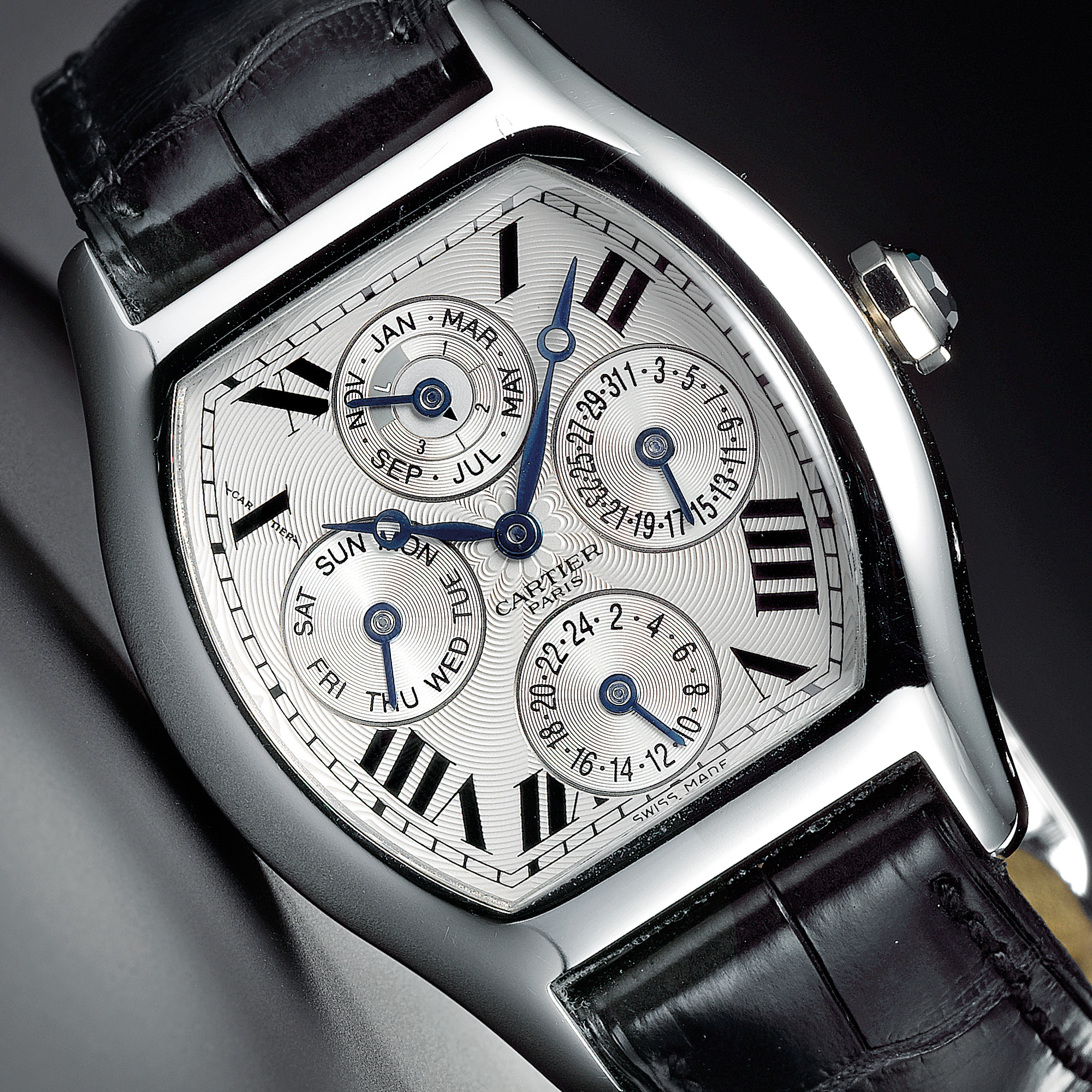 Cartier, A FINE AND RARE PLATINUM TONNEAU FORM AUTOMATIC PERPETAUL CALENDAR WRISTWATCH WITH LEAP YEAR AND 24-HOUR INDICATION CIRCA 2005 NO 068