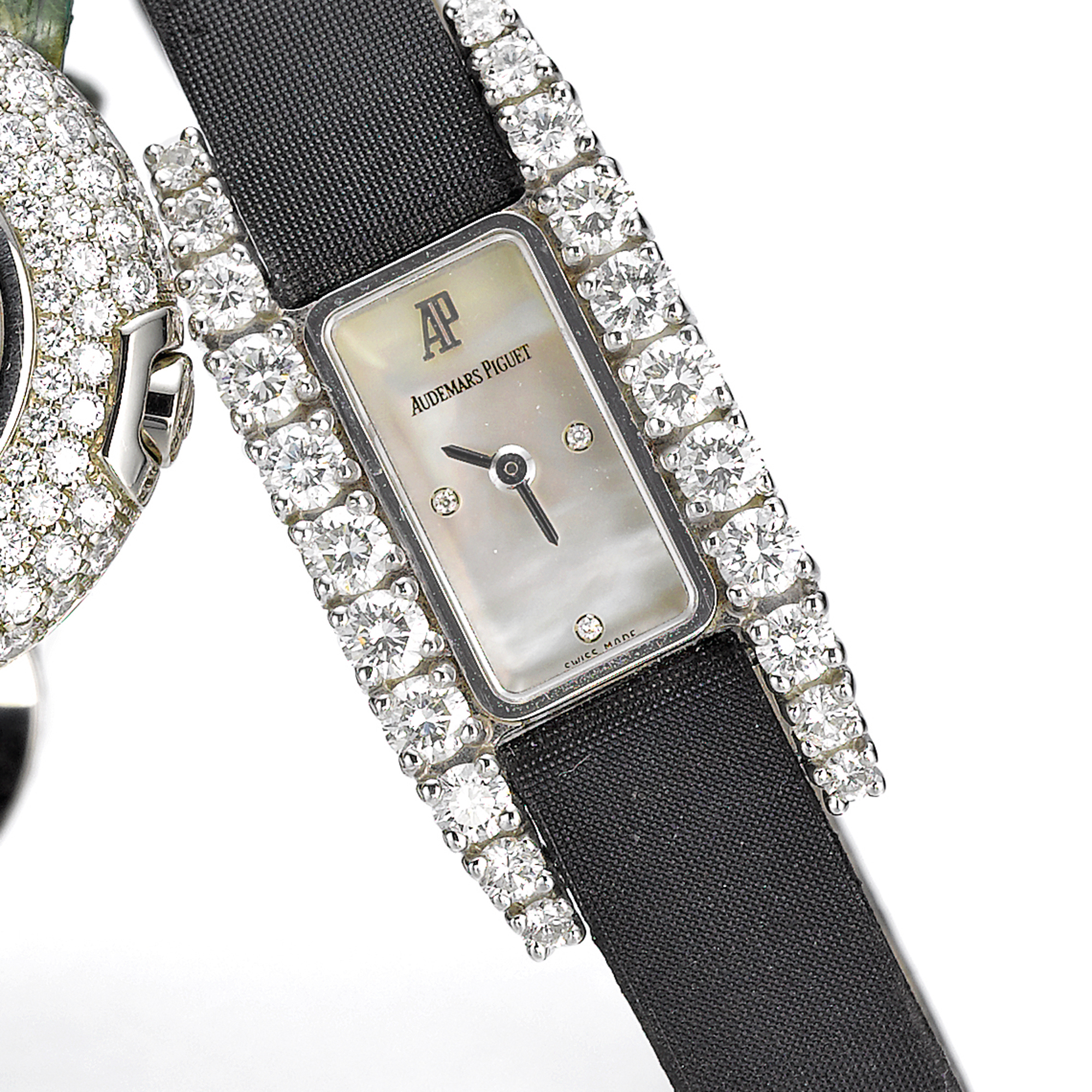 Audemars Piguet, A LADY'S WHITE GOLD AND DIAMOND SET RECTANGULAR WRISTWATCH WITH MOTHER-OF-PEARL DIAL CIRCA 2002