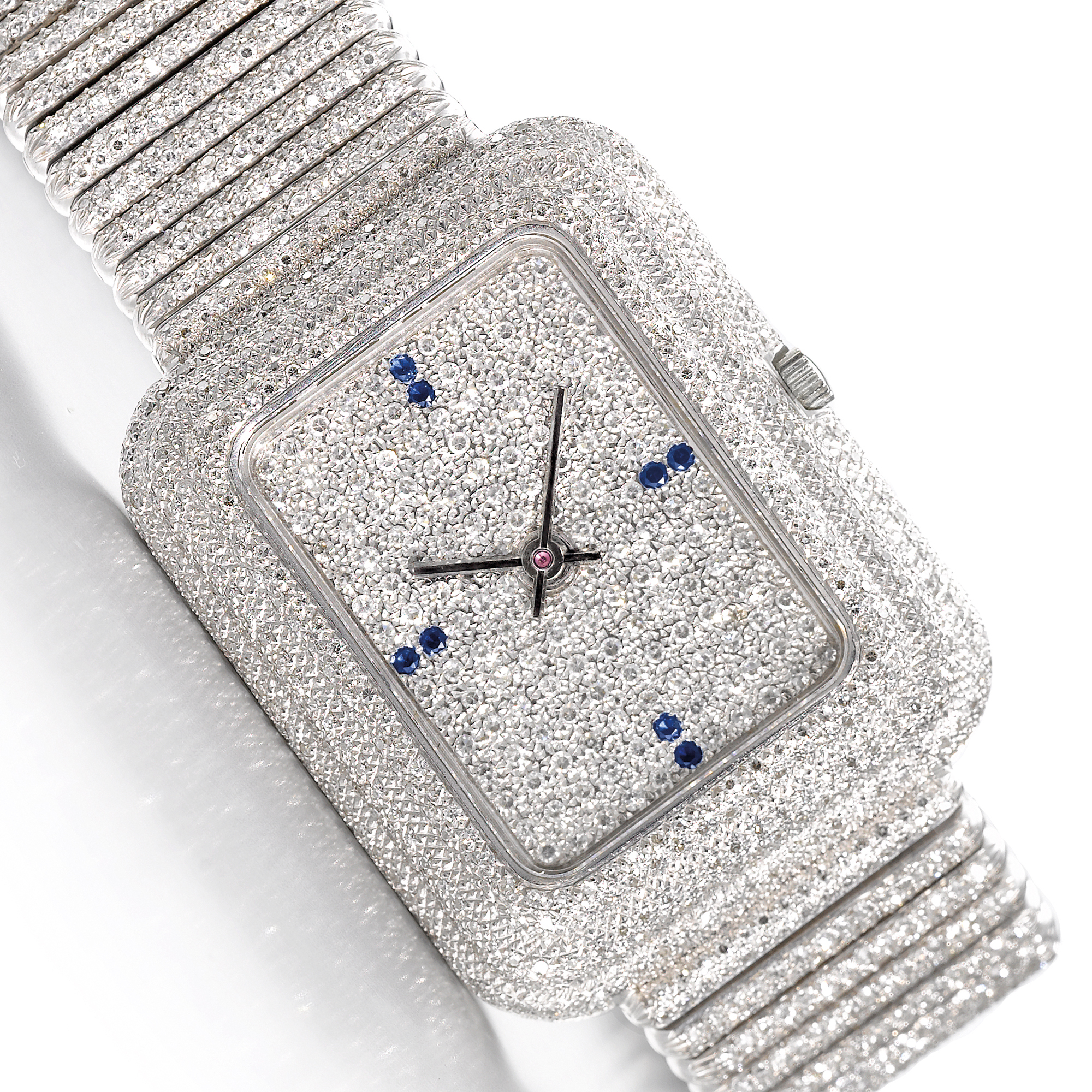 Piaget, A LARGE WHITE GOLD, DIAMOND AND SAPPHIRE SET RECTANGULAR BRACELET WATCH CIRCA 1970