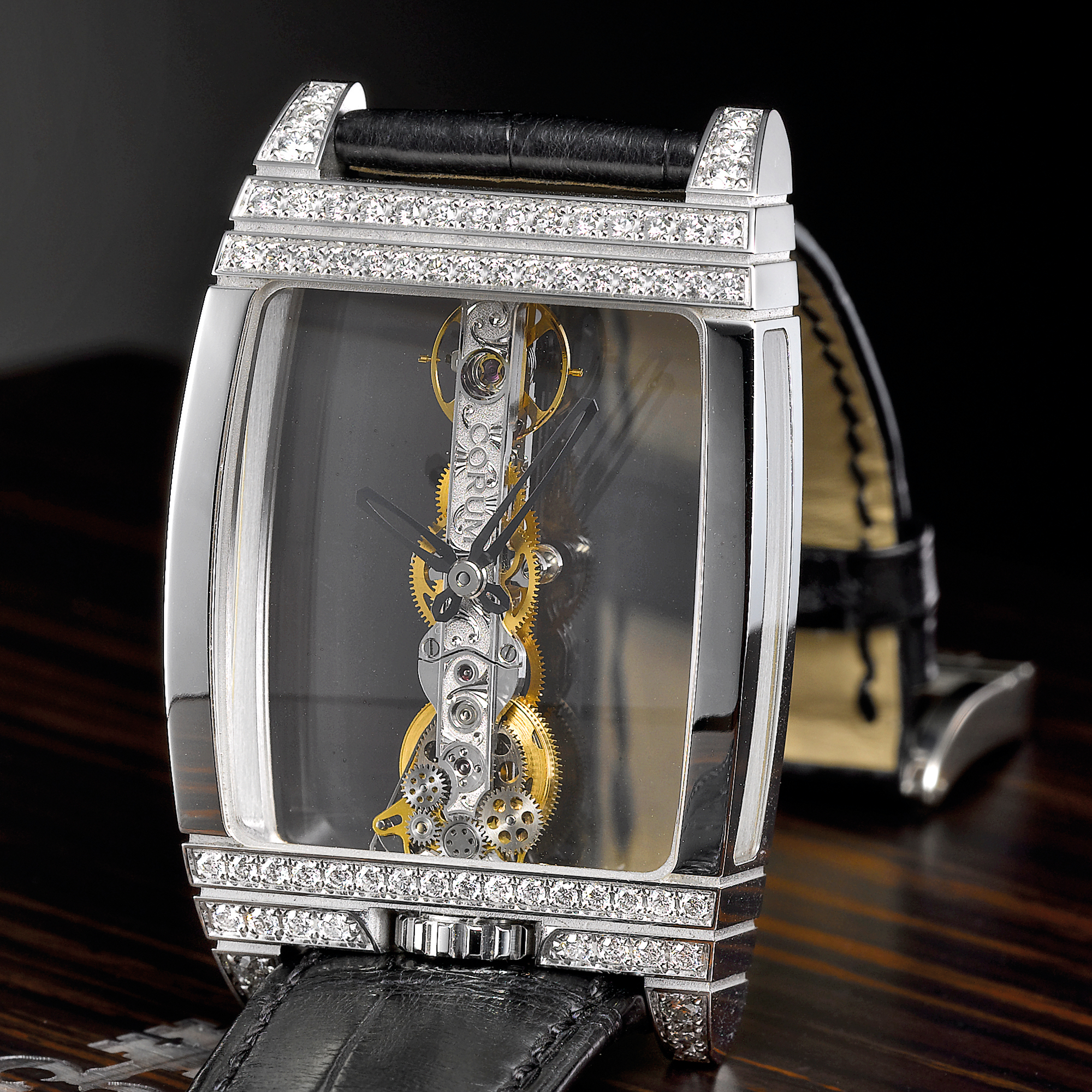 Corum, A FINE LARGE WHITE GOLD AND DIAMOND SKELETONIZED TONNEAU WRISTWATCH CIRCA 2005 GOLDEN BRIDGE 50TH ANNIVERSARY