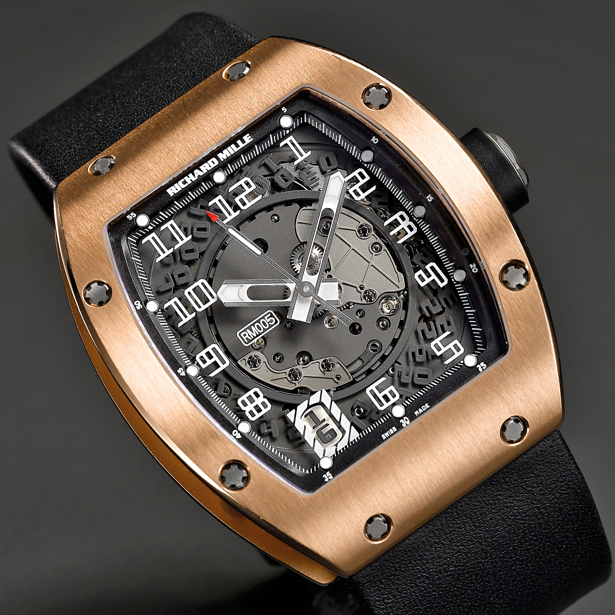 Richard Mille, A FINE AND UNUSUAL PINK GOLD TONNEAU FORM AUTOMATIC CENTER SECONDS WRISTWATCH WITH DATE AND SKELETONIZED DIAL CIRCA 2005 RM-005