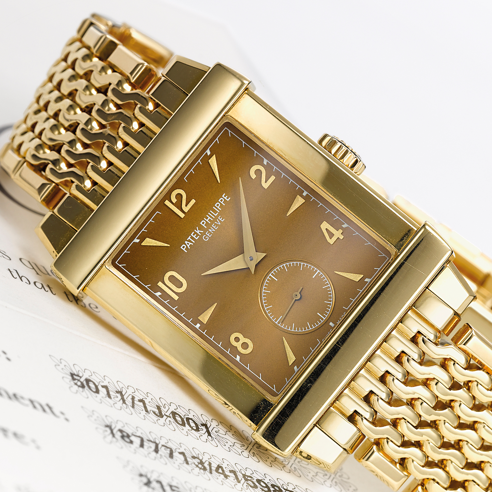 Patek Philippe, A LIMITED EDITION YELLOW GOLD RECTANGULAR BRACELET WATCH CIRCA 2001 REF 5011J CORTINA GONDOLO MVT 1877713 CASE 4159870