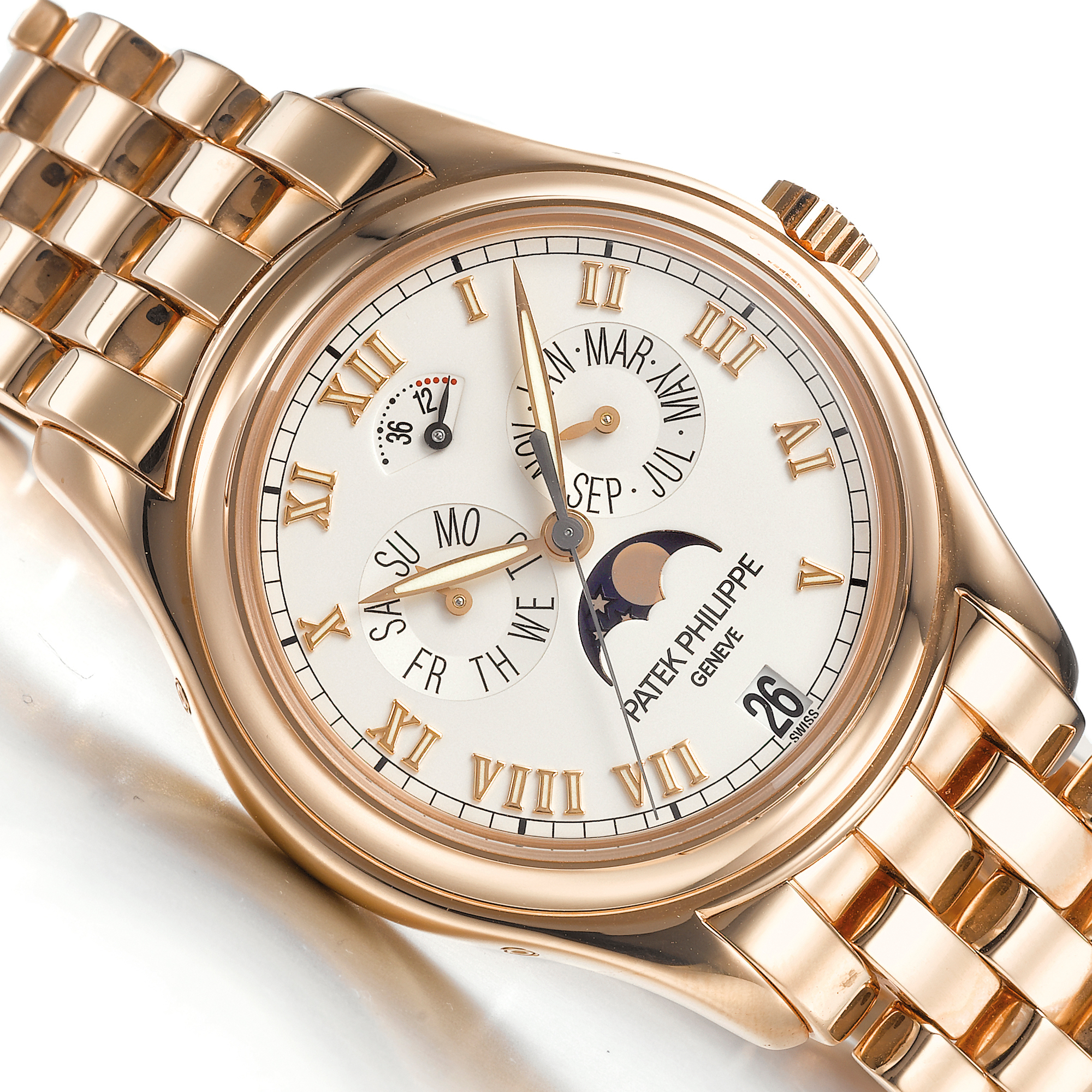 Patek Philippe, A FINE PINK GOLD AUTOMATIC CENTER SECONDS ANNUAL CALENDAR BRACELET WATCH WITH MOON-PHASES AND POWER RESERVE INDICATION CIRCA 2001 REF 5036R MVT 3145851 CASE 4146457