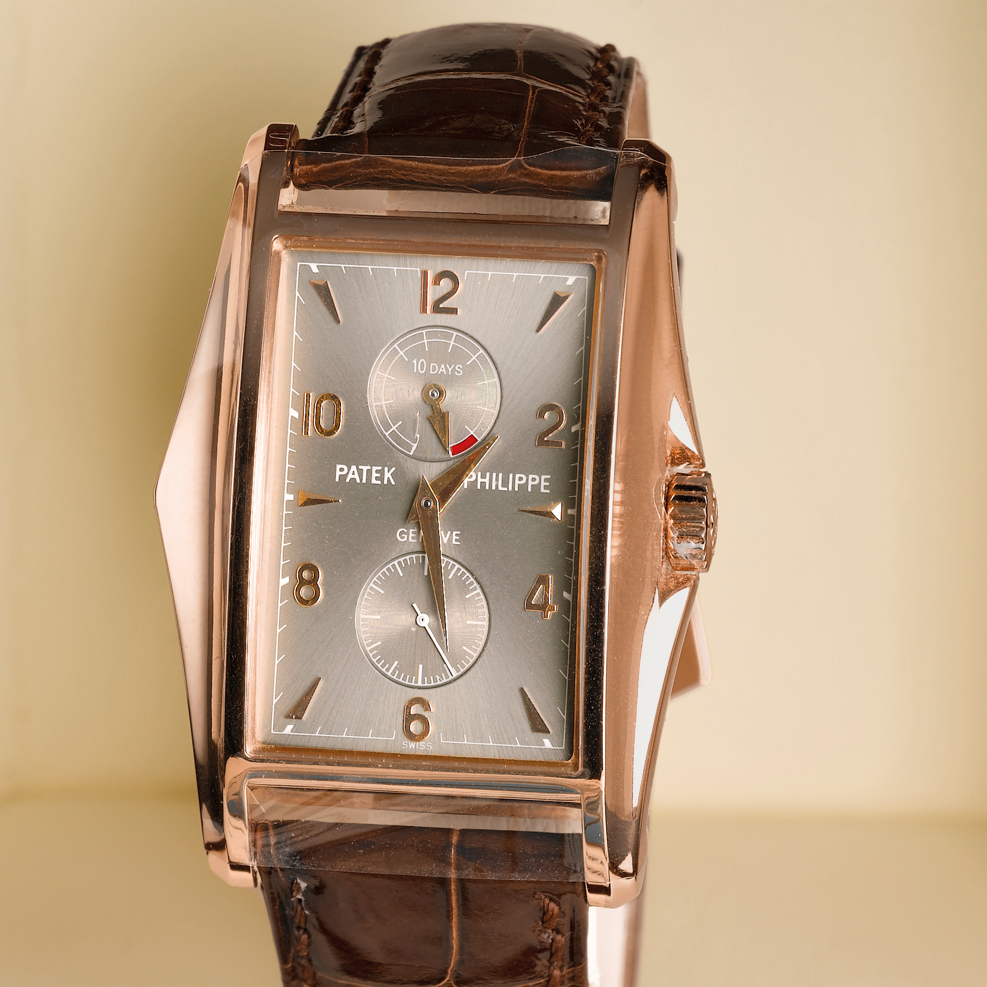 Patek Philippe, A FINE AND LIMITED EDITION PINK GOLD FLARED RECTANGULAR WRISTWATCH WITH TEN-DAY POWER RESERVE INDICATION 2000 REF. 5100R MVT 3202444 CASE 4102655