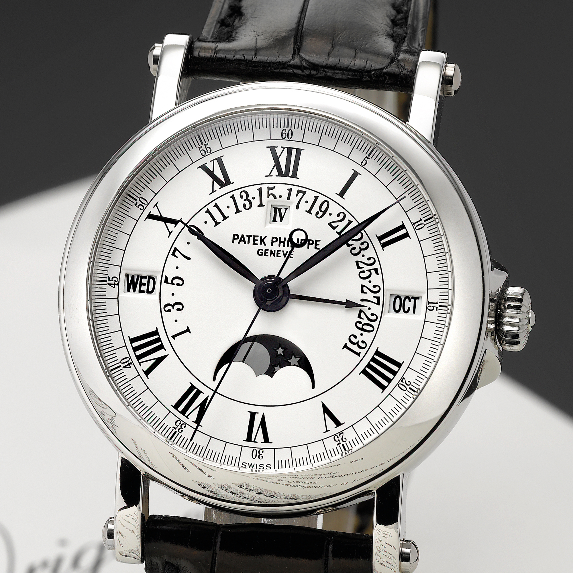 Patek Philippe, A FINE PLATINUM AUTOMATIC CENTER SECONDS PERPETUAL CALENDAR WRISTWATCH WITH RETROGRADE DATE AND MOON-PHASES AND LEAP YEAR INDICATION CIRCA 2000 REF 5059P MVT 3236733 CASE 4259617