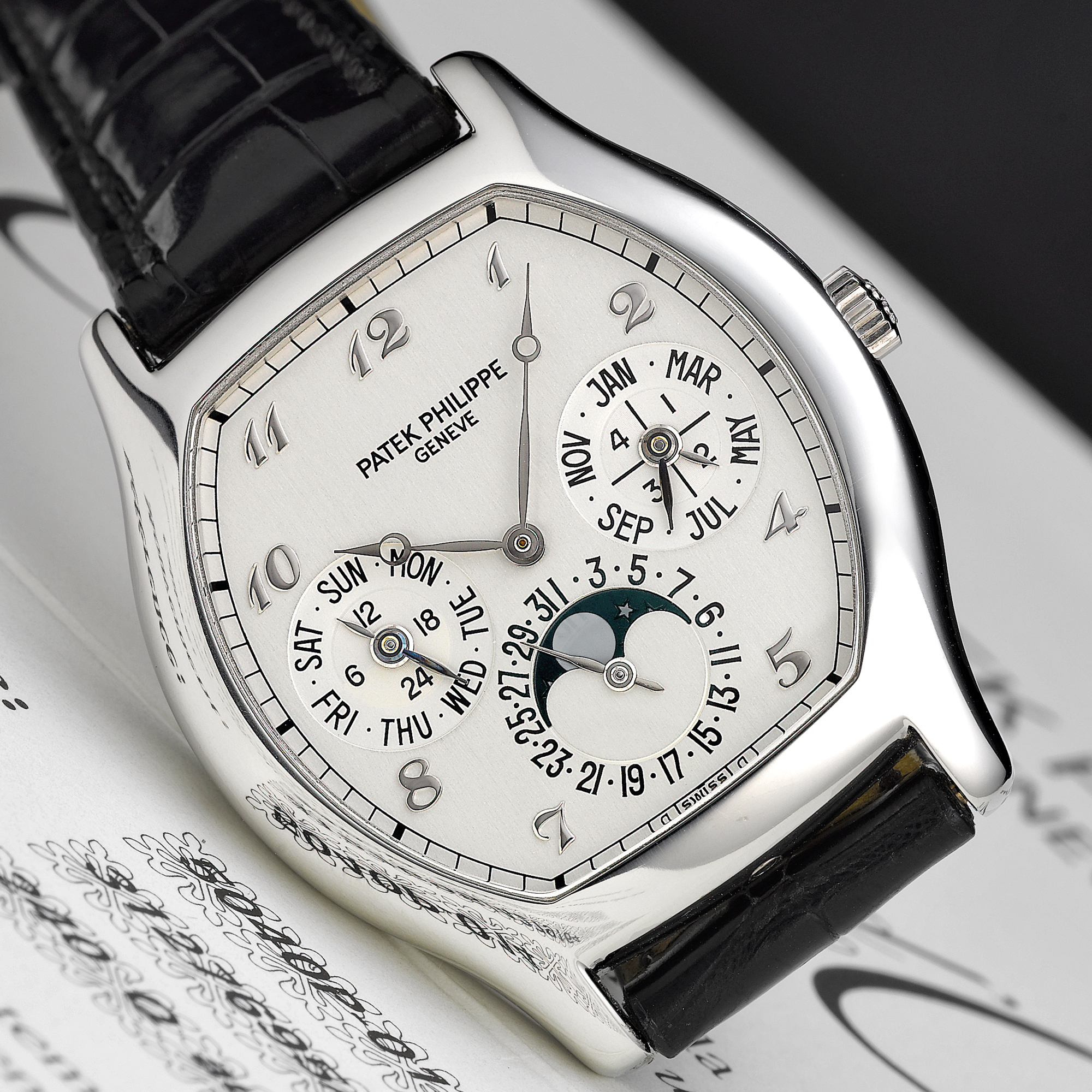 Patek Philippe, A FINE PLATINUM TONNEAU FORM AUTOMATIC PEPETUAL CALENDAR WRISTWATCH WITH MOON-PHASES CIRCA 2000 REF 5040P 2ND SERIES MVT 312795 CASE 4279164 