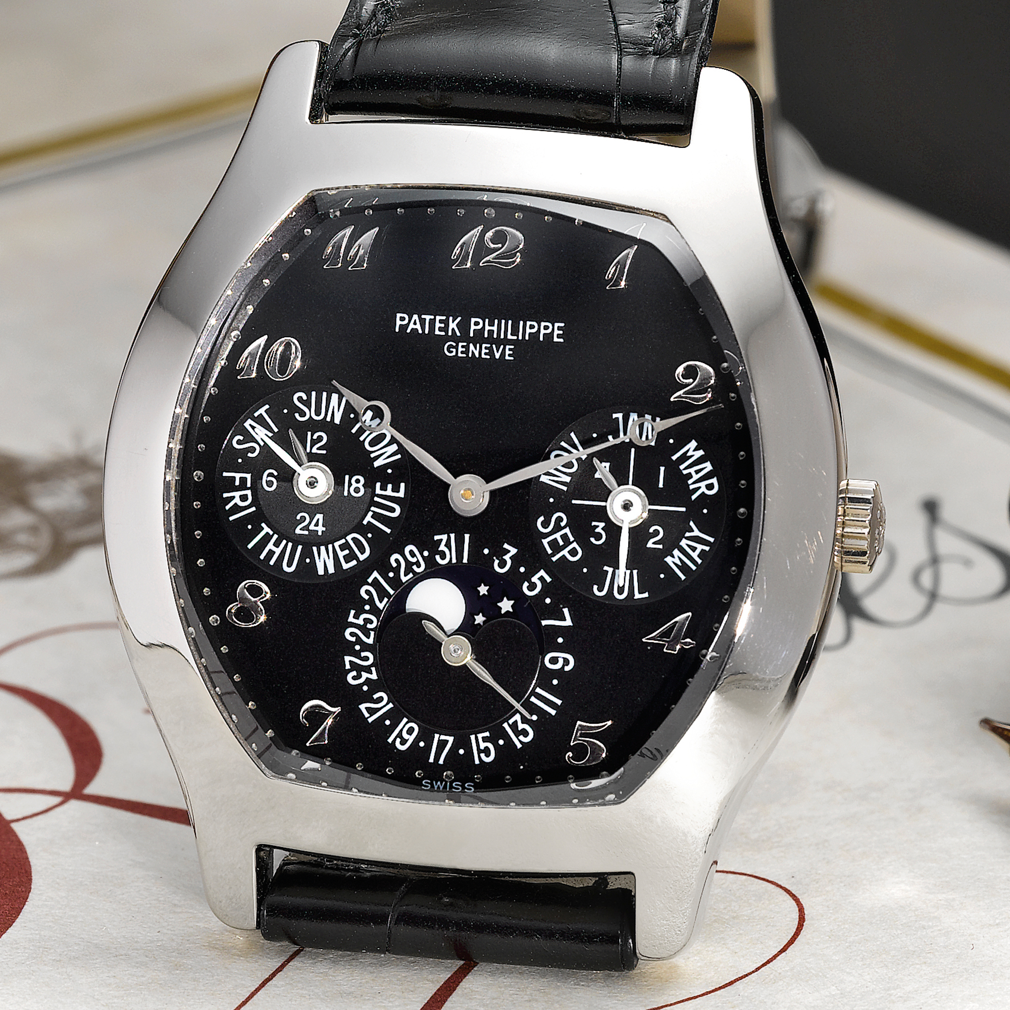 Patek Philippe, A VERY RARE AND FINE WHITE GOLD TONNEAU FORM AUTOMATIC PERPETUAL CALENDAR WRISTWATCH WITH MOON-PHASES, 24-HOUR AND LEAP YEAR INDICATION CIRCA REF 5041G MVT 3124352 CASE 4032602