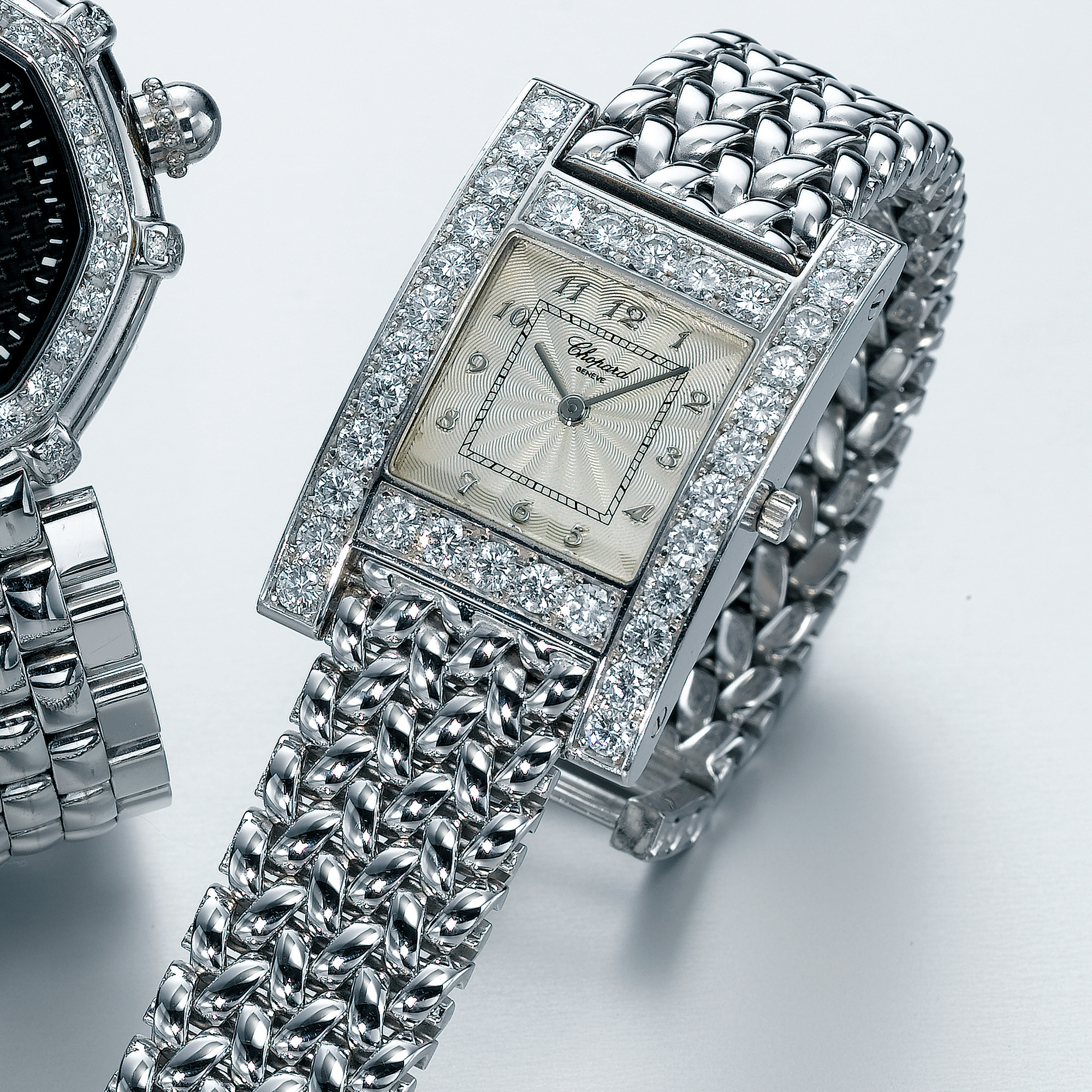 CHOPARD, A WHITE GOLD AND DIAMOND SET CURVED RECTANGULAR WRISTWATCH WITH BRACELETCIRCA 2003  