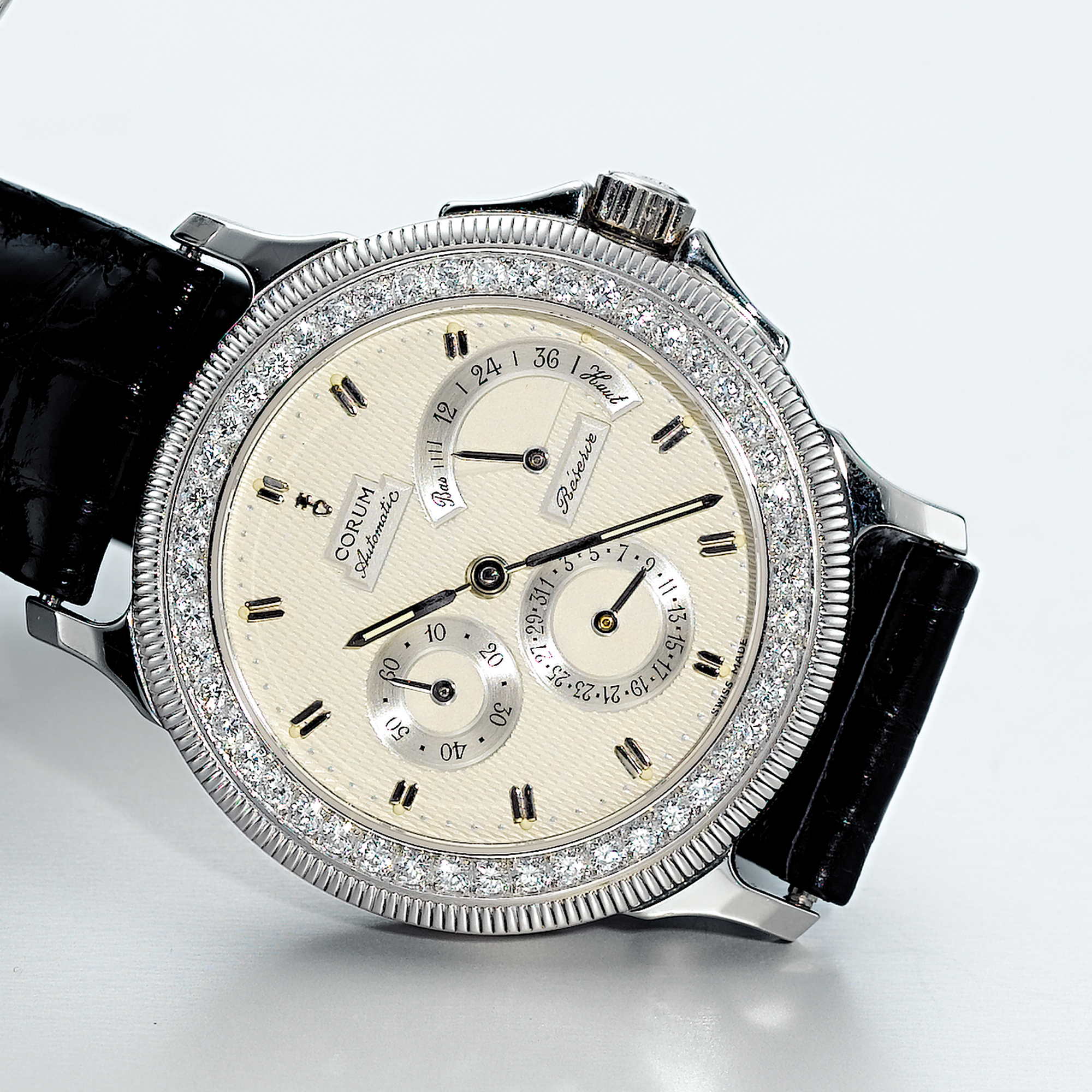 CORUM, A PLATINUM AND DIAMOND SET AUTOMATIC WRISTWATCH WITH POWER RESERVE AND DATECIRCA 1995 MARINE REPUBLIC