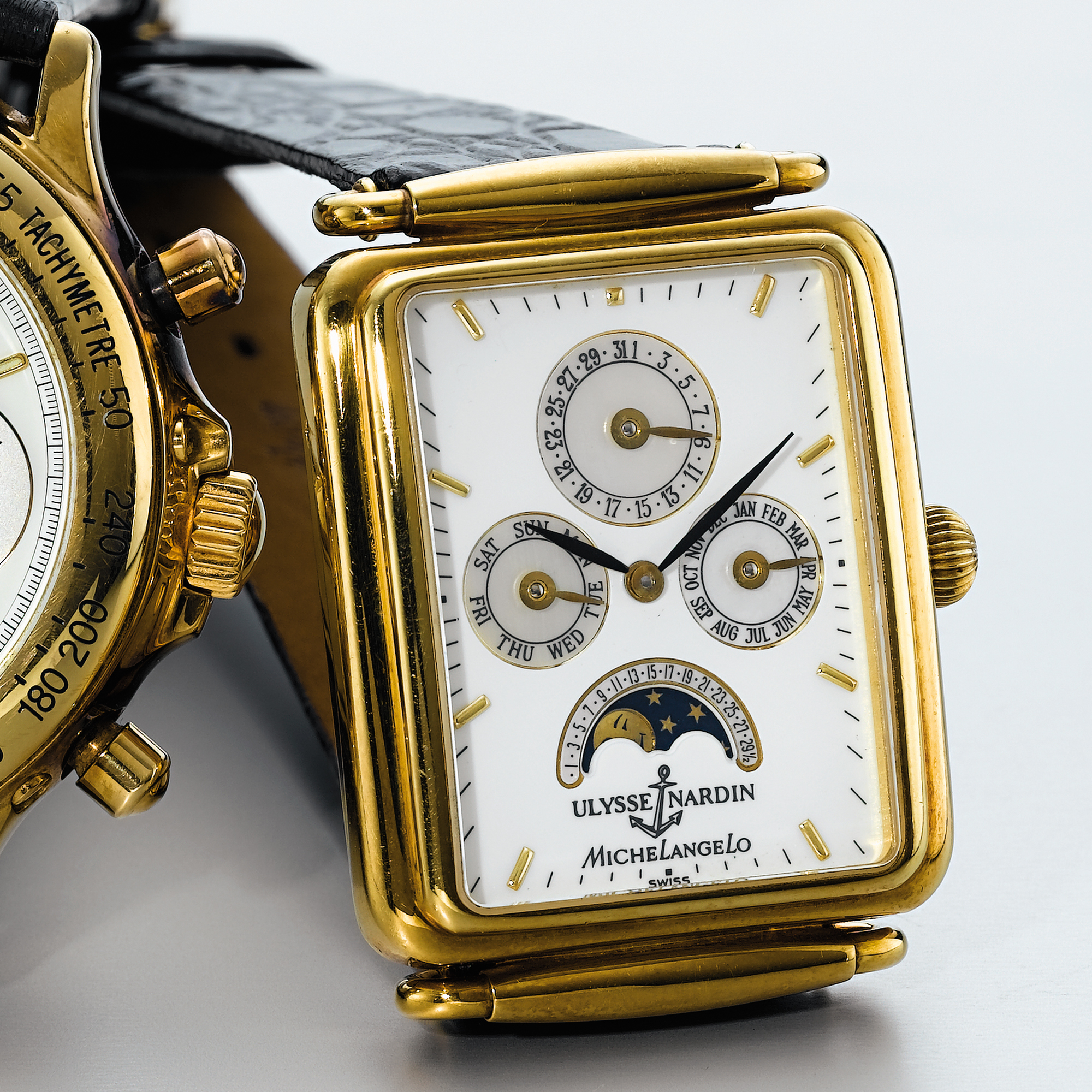 ULYSSE NARDIN, A GOLD AUTOMATIC RECTANGULAR TRIPLE CALENDAR WRISTWATCH WITH MOON-PHASESCIRCA 1990 MICHELANGELO