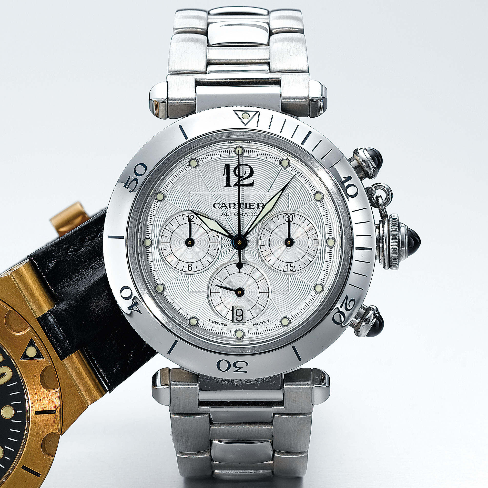 CARTIER, A STAINLESS STEEL AUTOMATIC CHRONOGRAPH WRISTWATCH WITH DATE, REGISTERS AND BRACELETCIRCA 2000 PASHA
