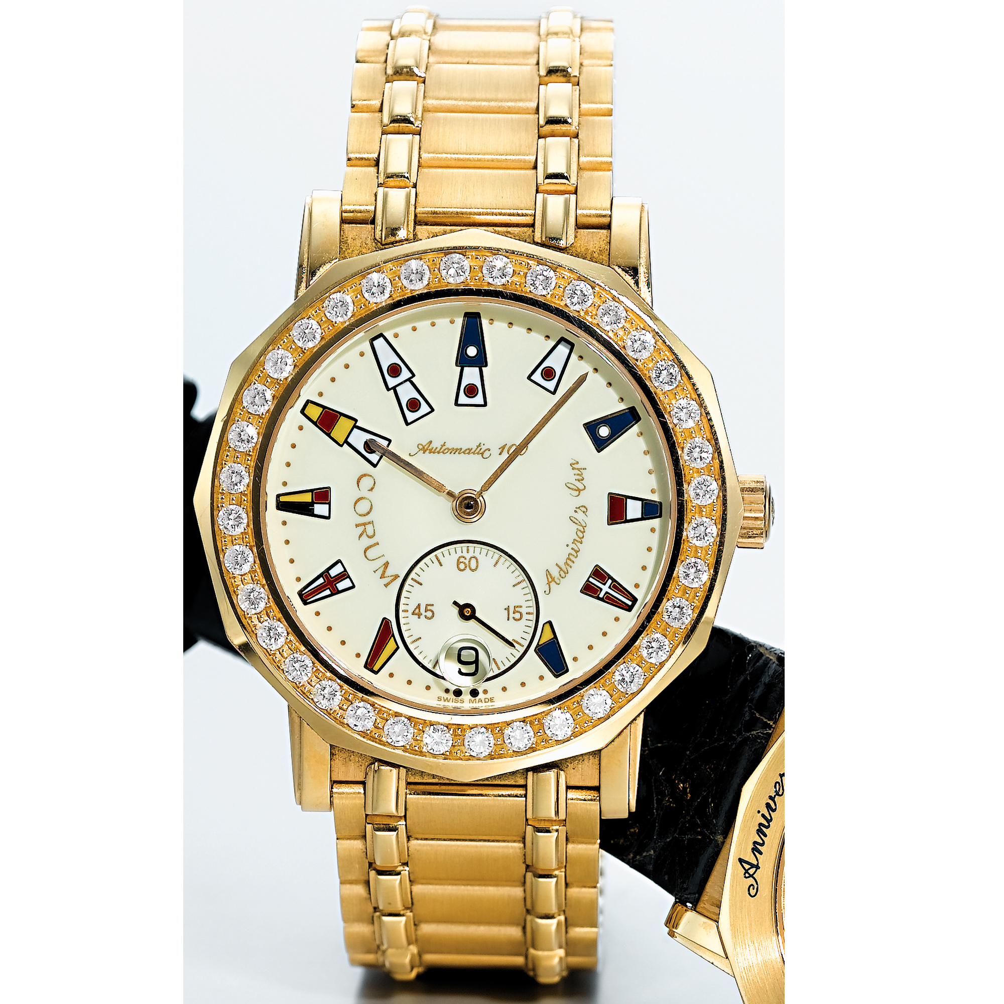 CORUM, A GOLD AND DIAMOND SET LIMITED EDITION AUTOMATIC WRISTWATCH WITH DATE AND BRACELETCIRCA 1995 ADMIRALS CUP NO 21/100