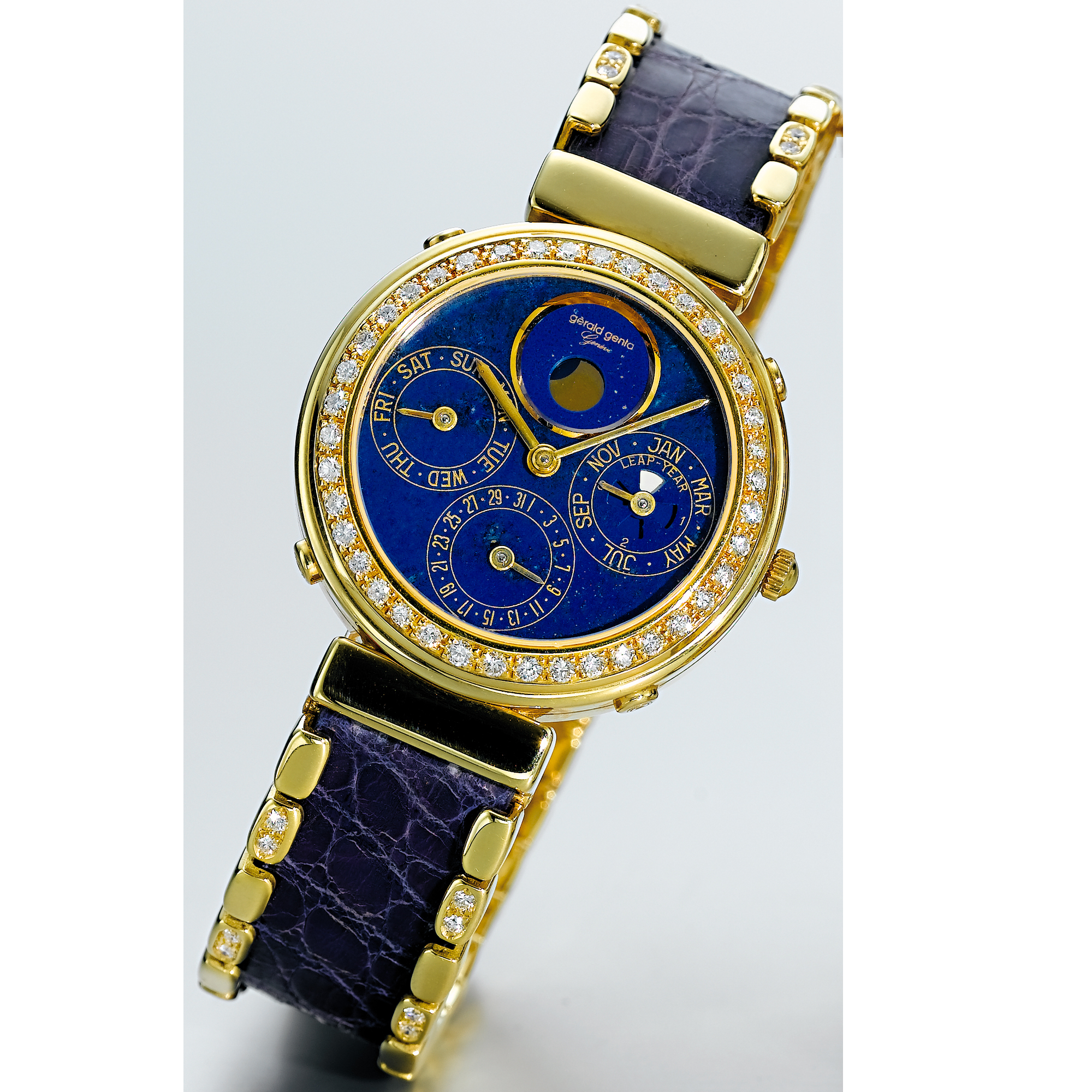 GÉRALD GENTA, A GOLD AND DIAMOND SET AUTOMATIC PERPETUAL CALENDAR BRACELET WATCH WITH MOON-PHASES AND LAPIS LAZULI DIALCIRCA 1998