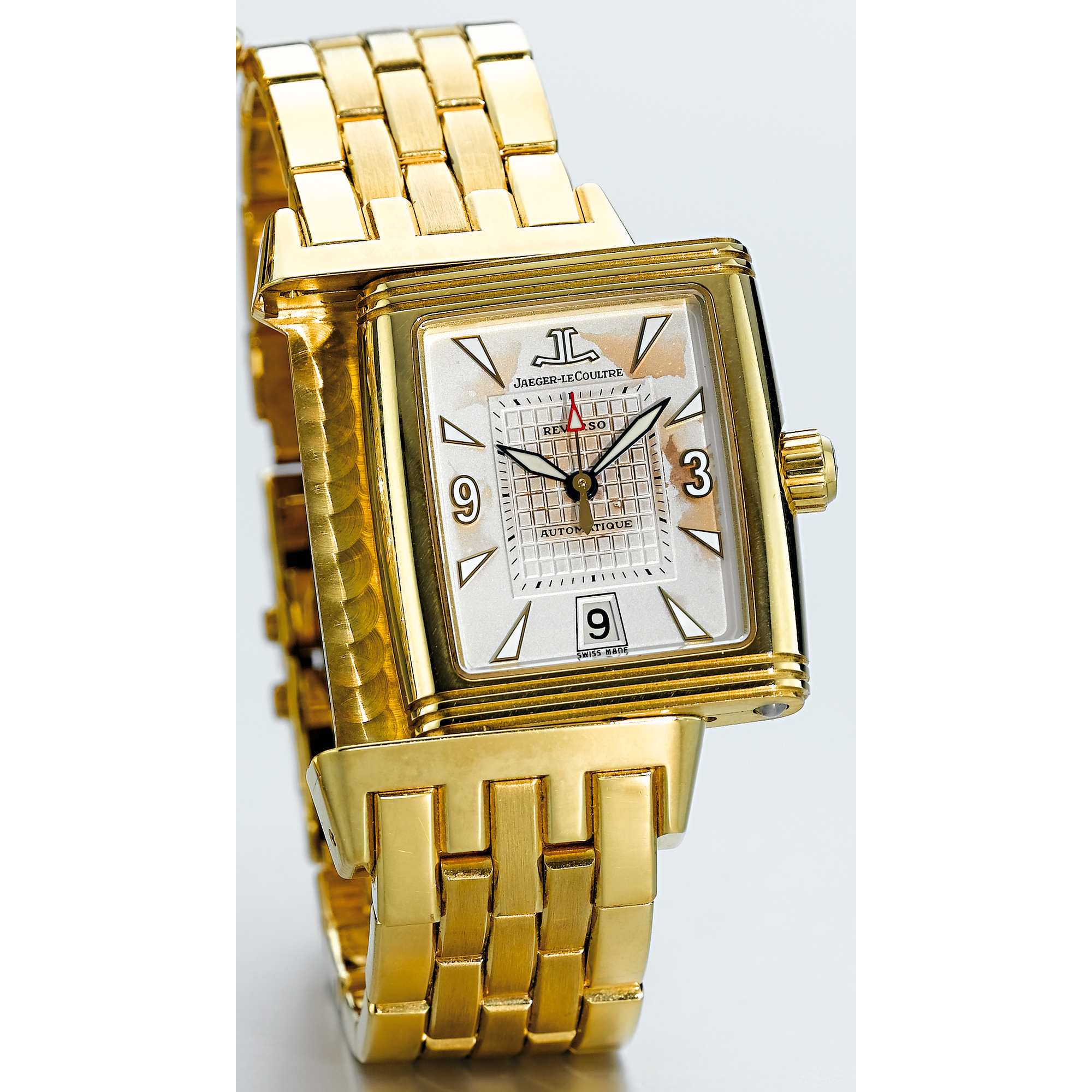 JAEGER-LECOULTRE, A GOLD REVERSIBLE AUTOMATIC CENTRE SECONDS RECTANGULAR BRACELET WATCH WITH DATE CIRCA 2000 REVERSO