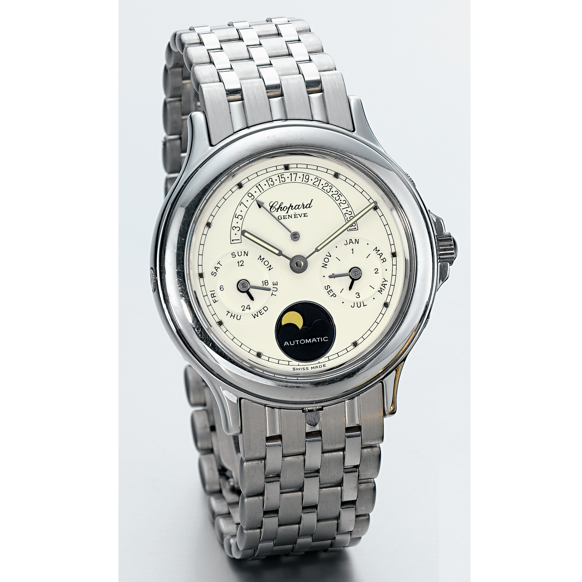 CHOPARD, A WHITE GOLD AUTOMATIC PERPETUAL CALENDAR WRISTWATCH WITH RETROGRADE DATE, MOON-PHASES AND BRACELET CIRCA 1995