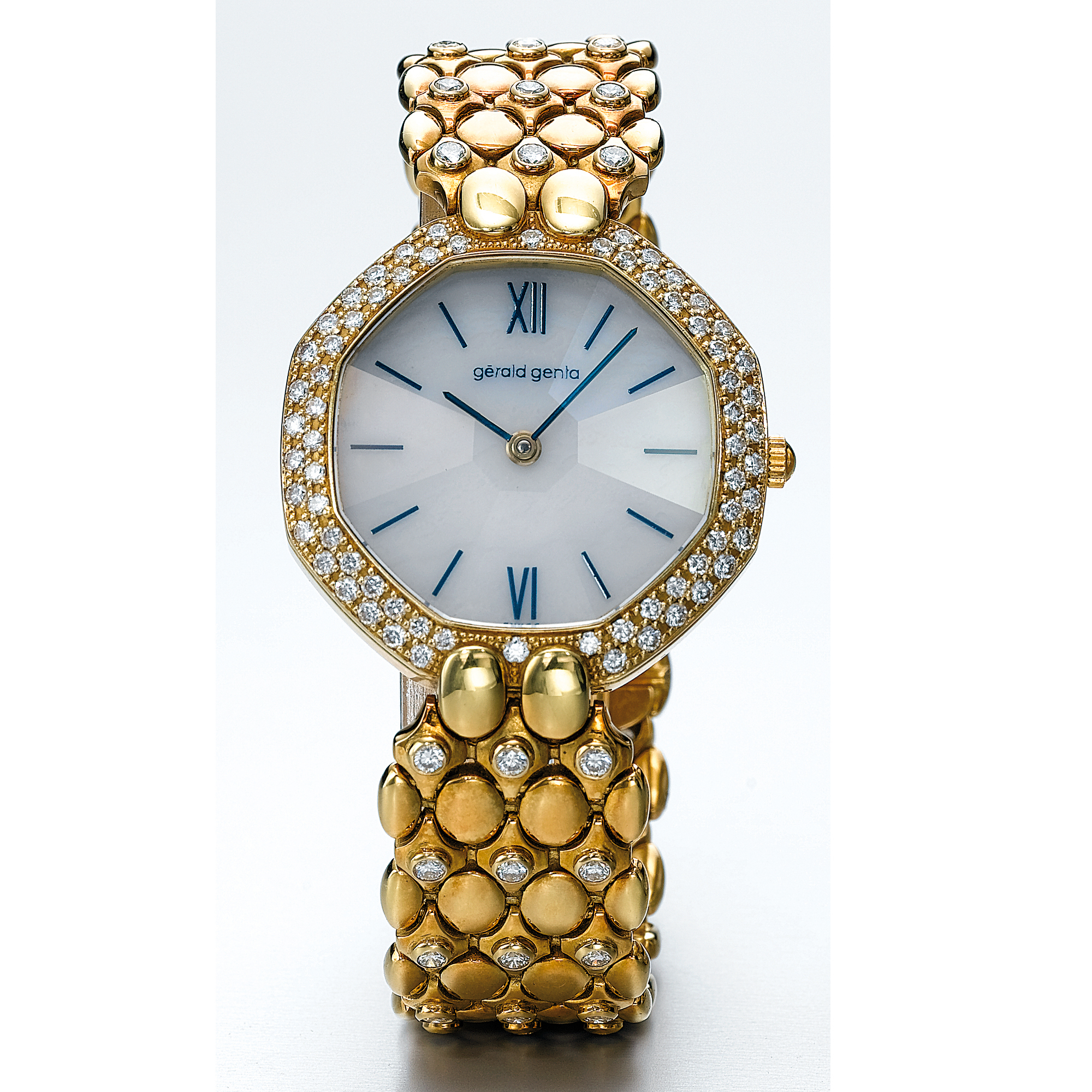 GÉRALD GENTA, A GOLD AND DIAMOND SET OCTAGONAL BRACELET WATCH WITH HARDSTONE DIAL CIRCA 1995