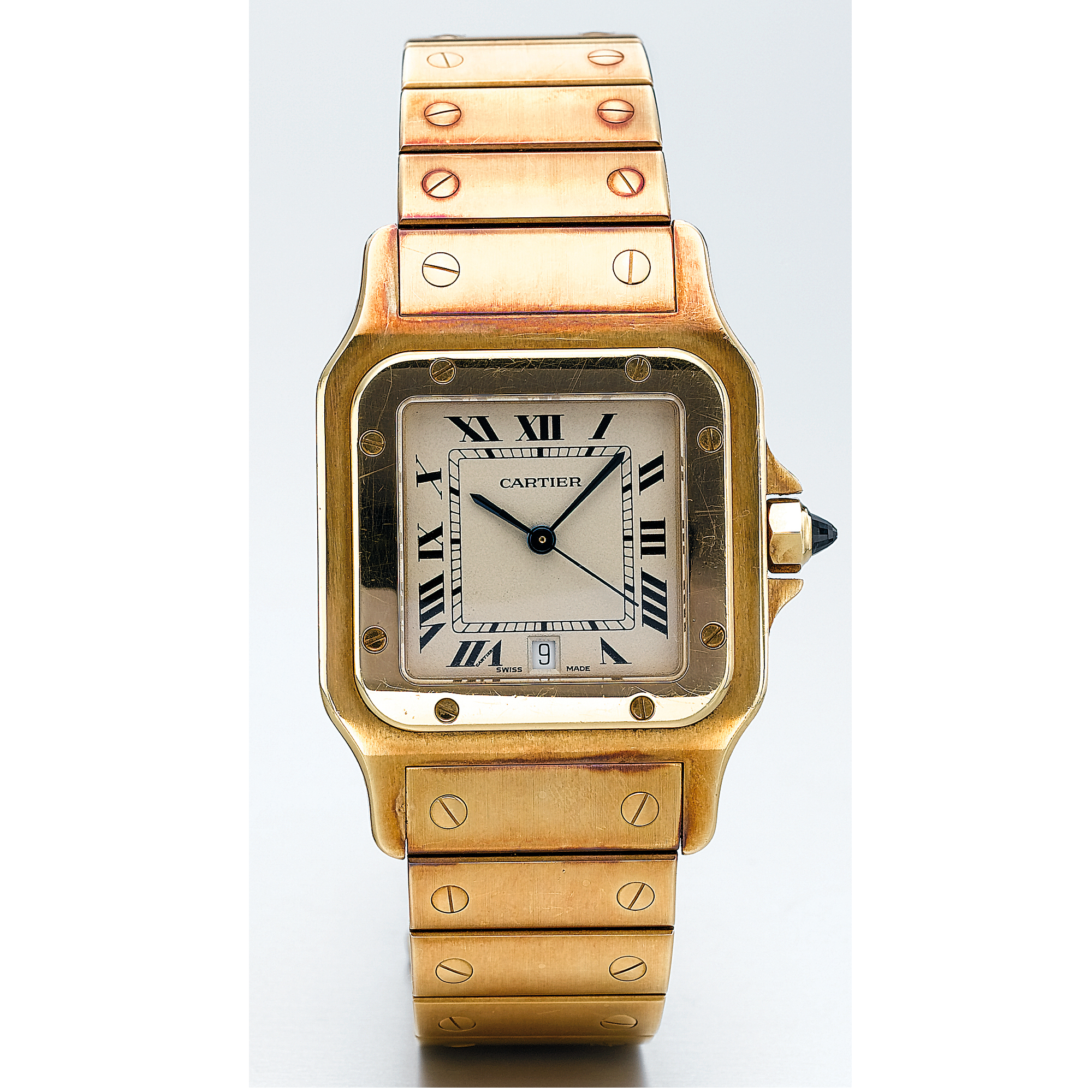 CARTIER, A GOLD SQUARE BRACELET WATCH WITH DATECIRCA 1990 SANTOS