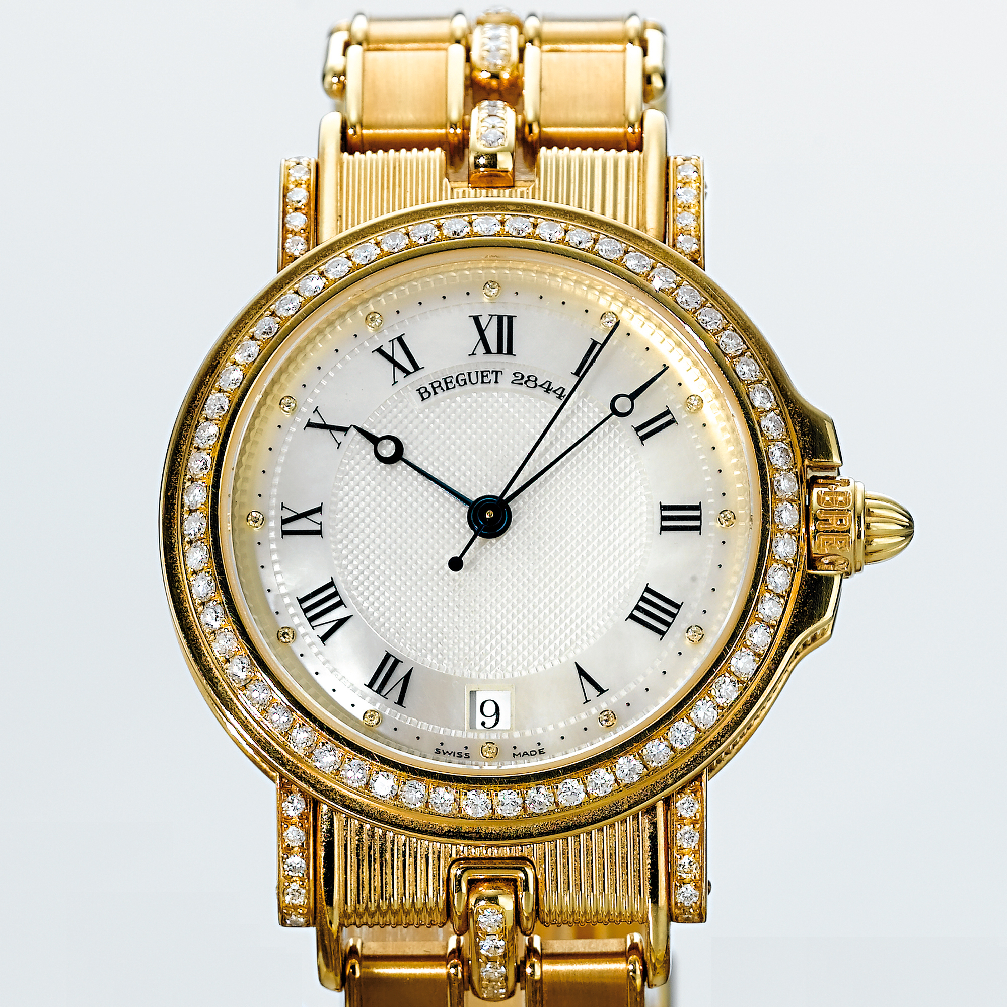 BREGUET, A GOLD AND DIAMOND AUTOMATIC CENTRE SECONDS WRISTWATCH WITH DATE, BRACELET AND MOTHER-OF-PEARL DIALCIRCA 2000 MARINE