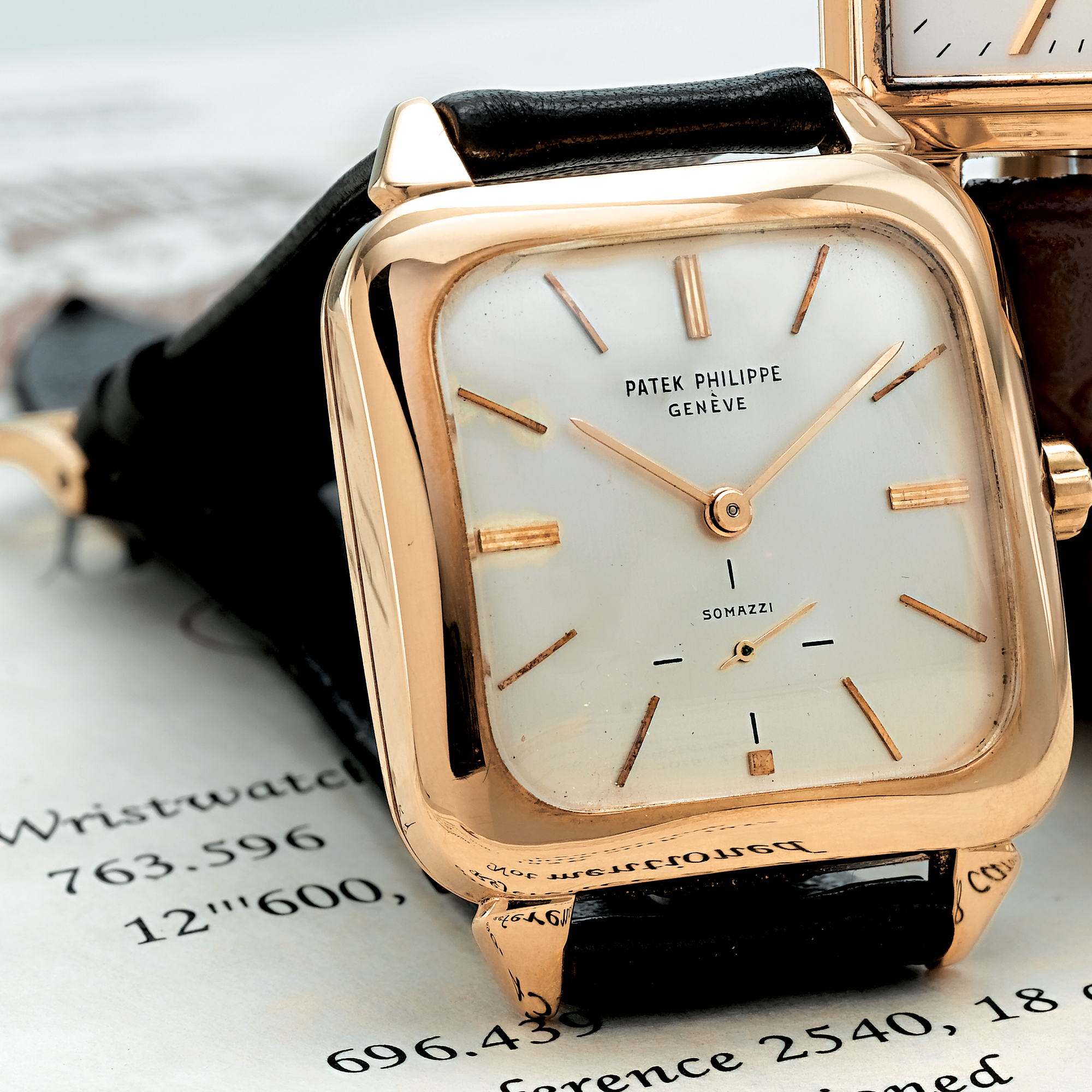 PATEK PHILIPPE, RETAILED BY SOMAZZI: A FINE GOLD CUSHION FORM AUTOMATIC WRISTWATCH 1956 REF 2540J MVT 763596 CASE 696439