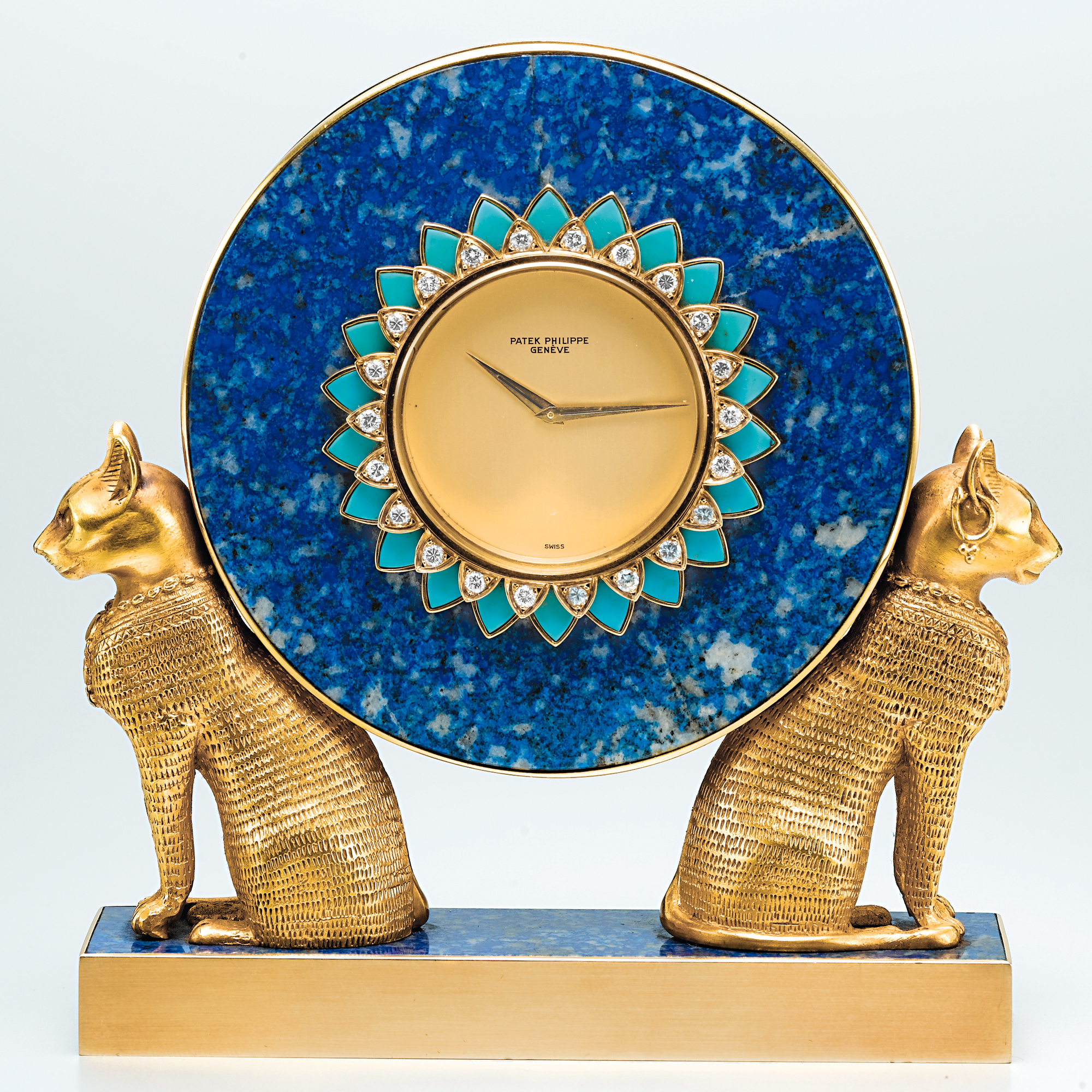 PATEK PHILIPPE, A FINE AND UNIQUE GOLD, LAPIS LAZULI, TURQUOISE AND DIAMOND SET MINIATURE EGYPTIAN-STYLE TABLE CLOCK1978 REF 2011 MVT 1500401 CASE 2780492