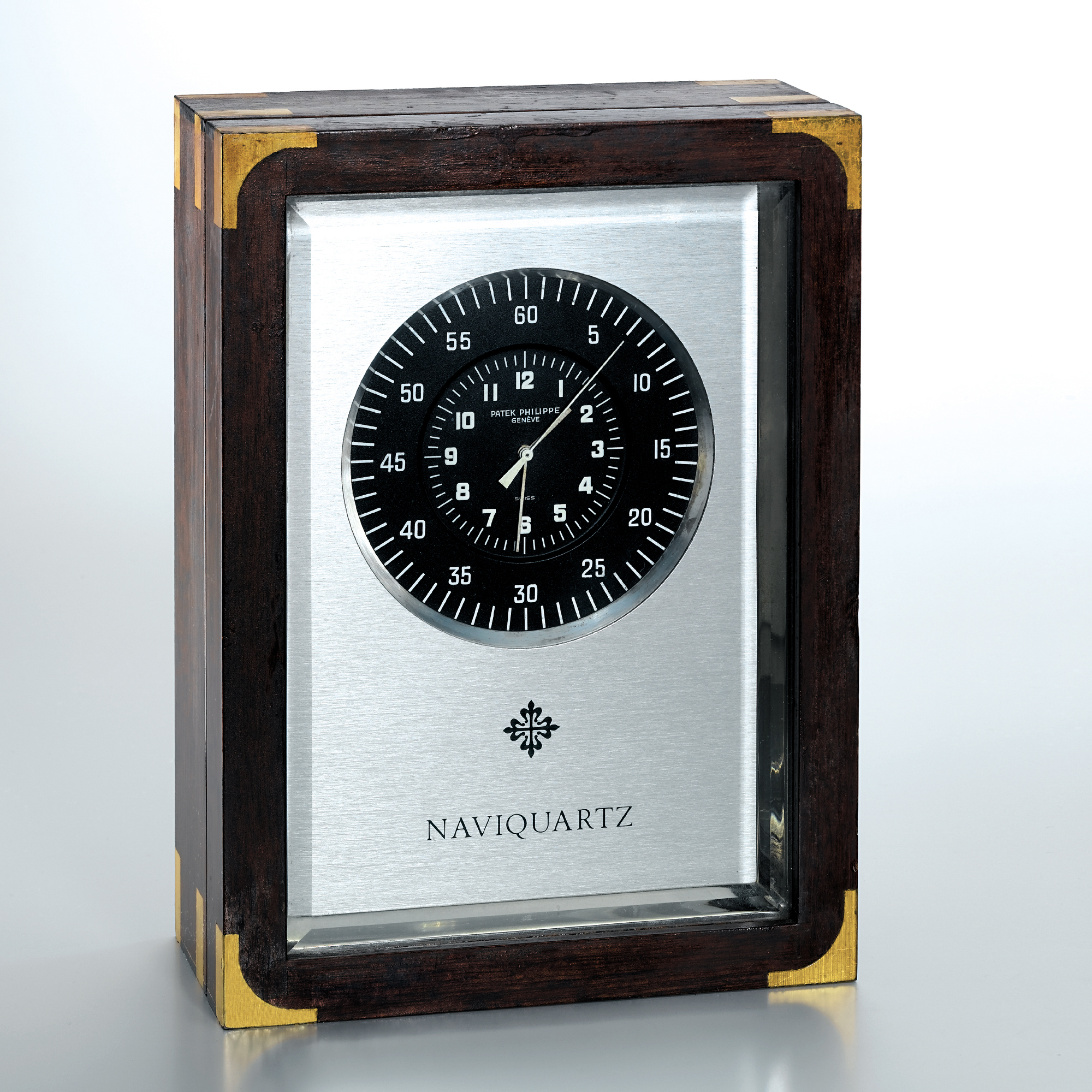 PATEK PHILIPPE, A RECTANGULAR CENTRE SECONDS QUARTZ TIMEPIECE IN A BRASS BOUND MAHOGANY CASECIRCA 1970 REF E 1200 NAVIQUARTZ NO 1800591