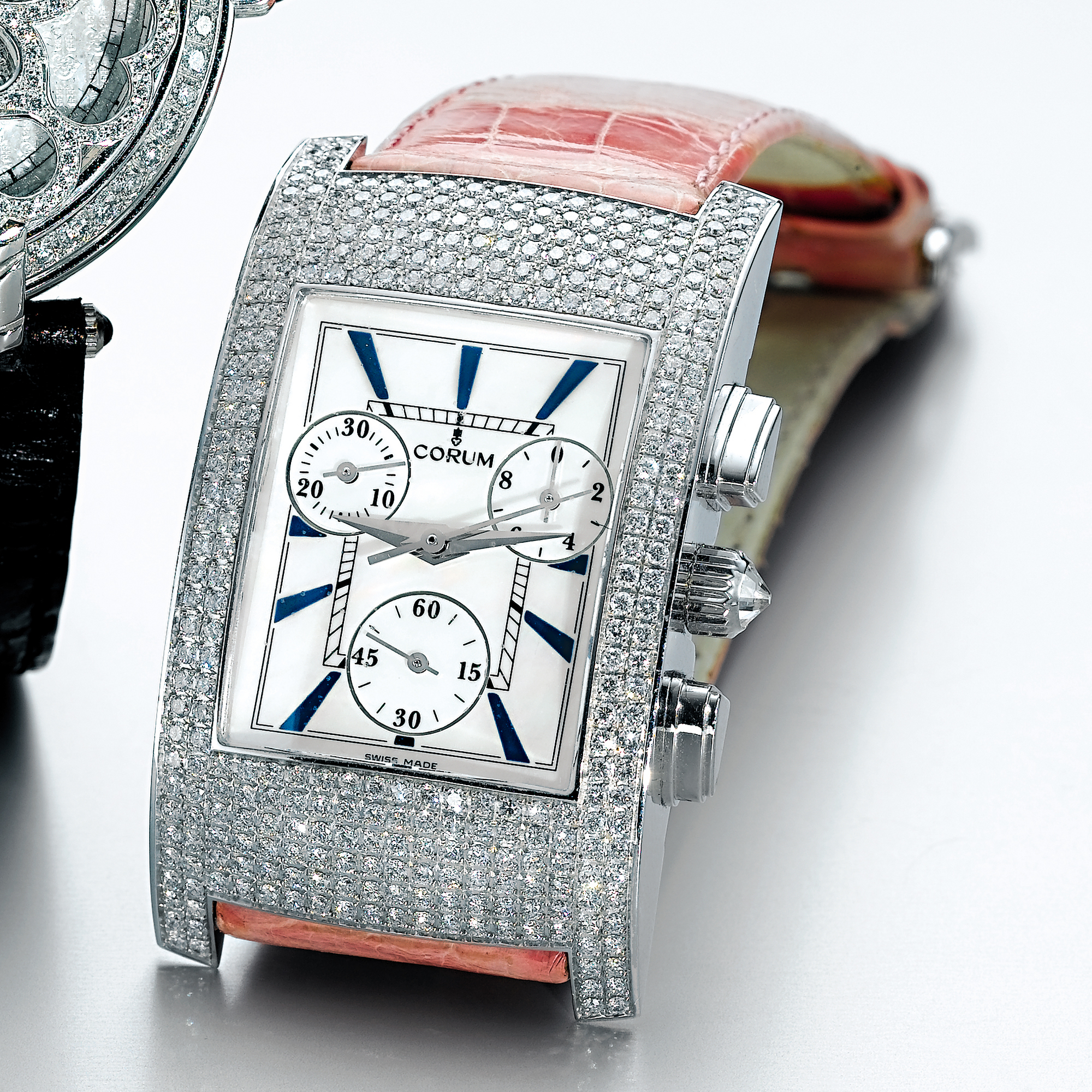 CORUM, A LADY'S WHITE GOLD AND DIAMOND SET RECTANGULAR CHRONOGRAPH WRISTWATCH WITH REGISTERS AND MOTHER-OF-PEARL DIALCIRCA 2004 
