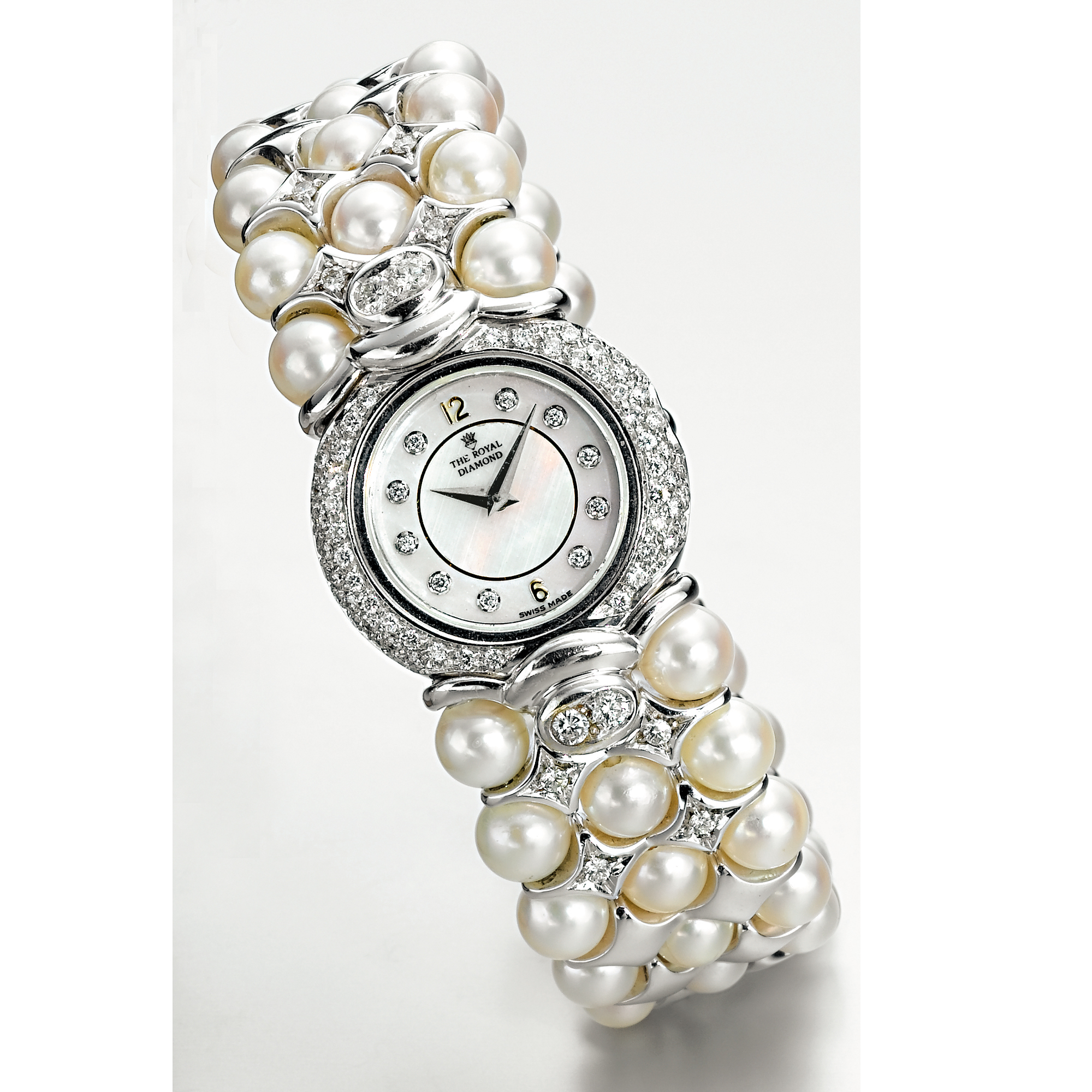 THE ROYAL DIAMOND, A LADY'S WHITE GOLD, DIAMOND AND PEARL SET BRACELET WATCH CIRCA 1995