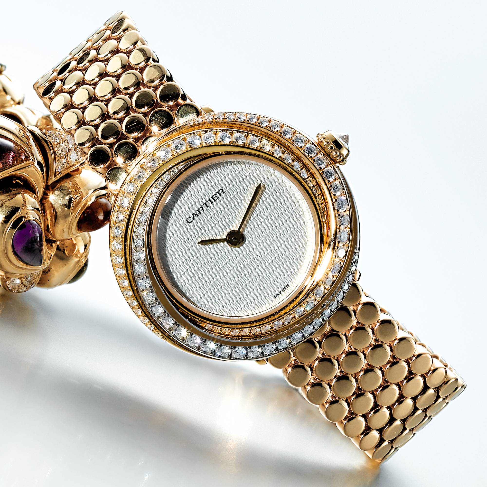CARTIER, A LADY'S THREE COLOUR GOLD AND DIAMOND SET WRISTWATCH WITH BRACELETCIRCA 2001