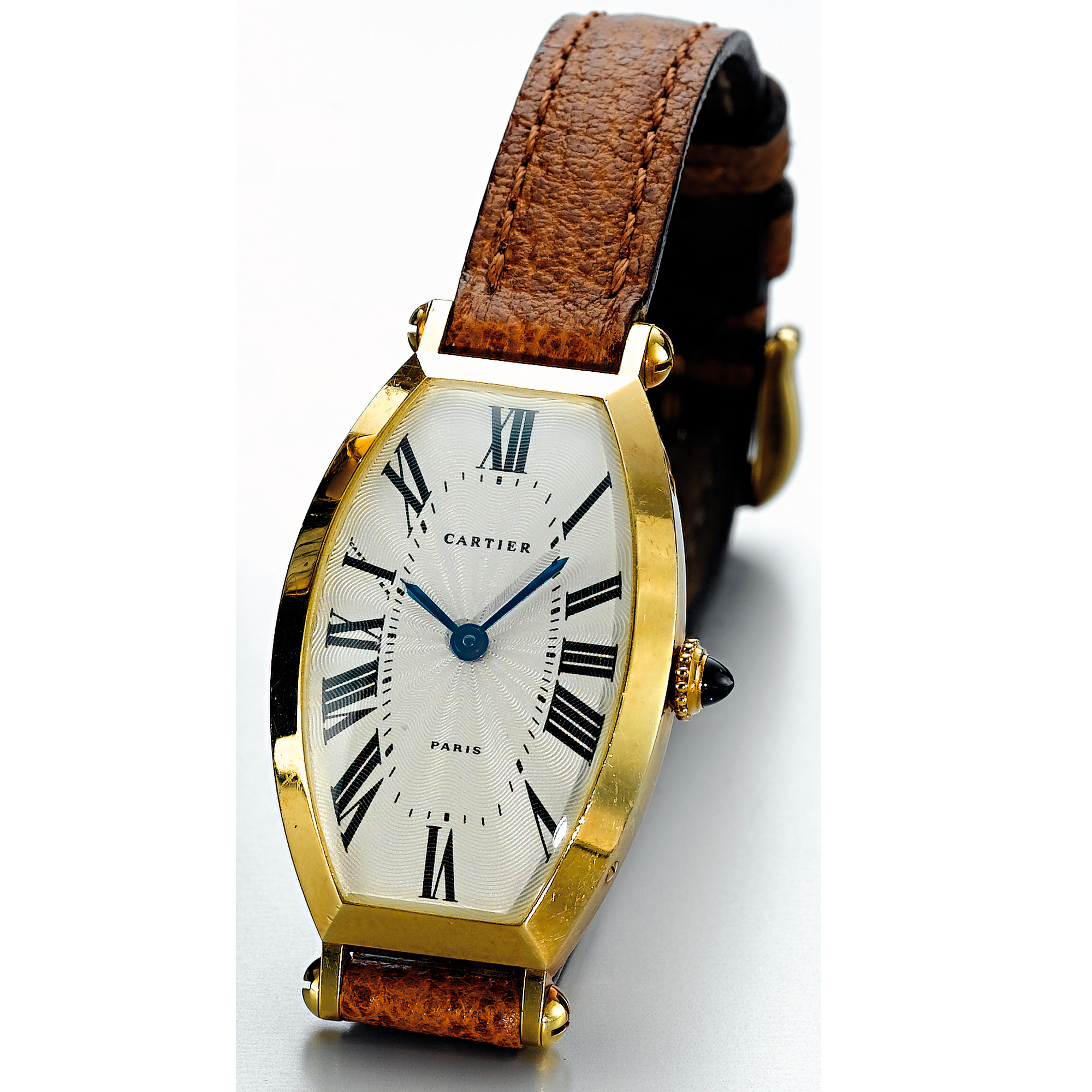 CARTIER, A LADY'S GOLD CURVED TONNEAU WRISTWATCH CIRCA 2000