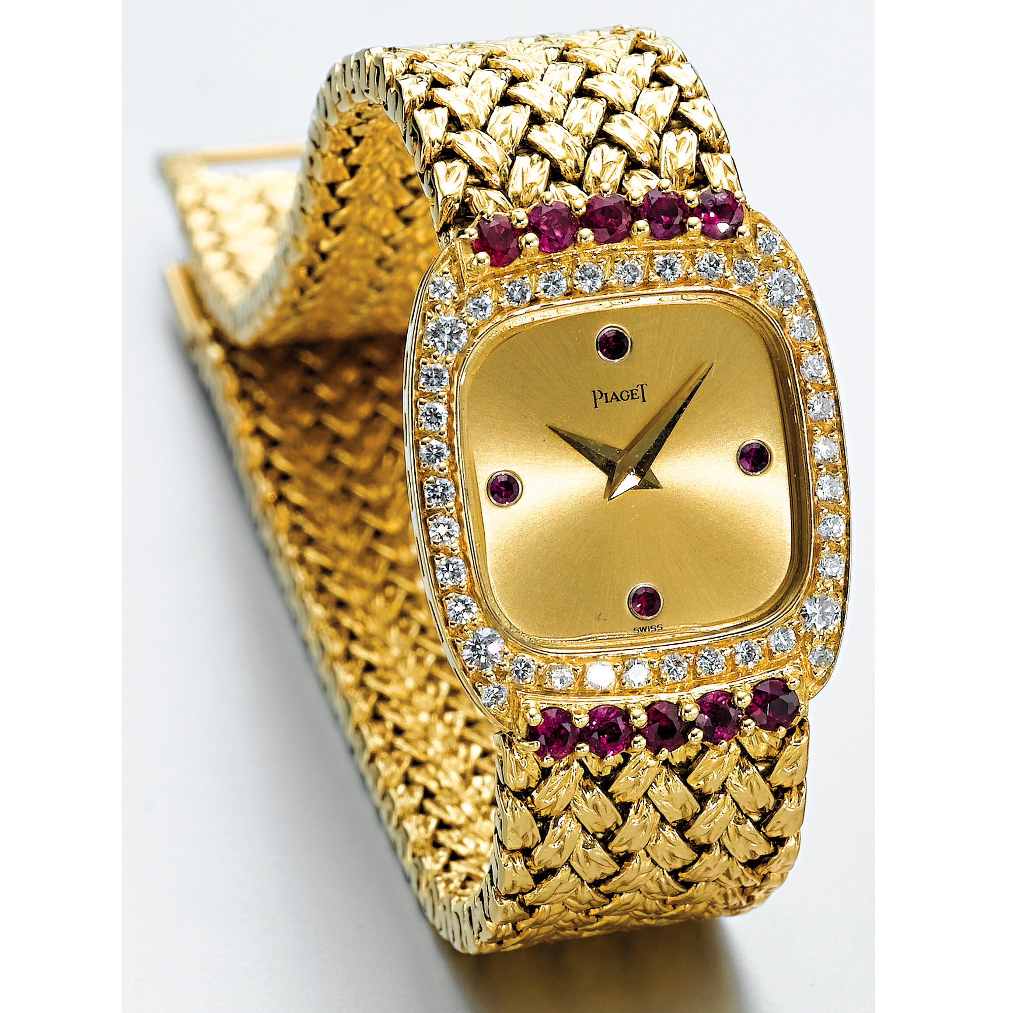 PIAGET, A LADY'S GOLD, DIAMOND AND RUBY SET BRACELET WATCHCIRCA 1990