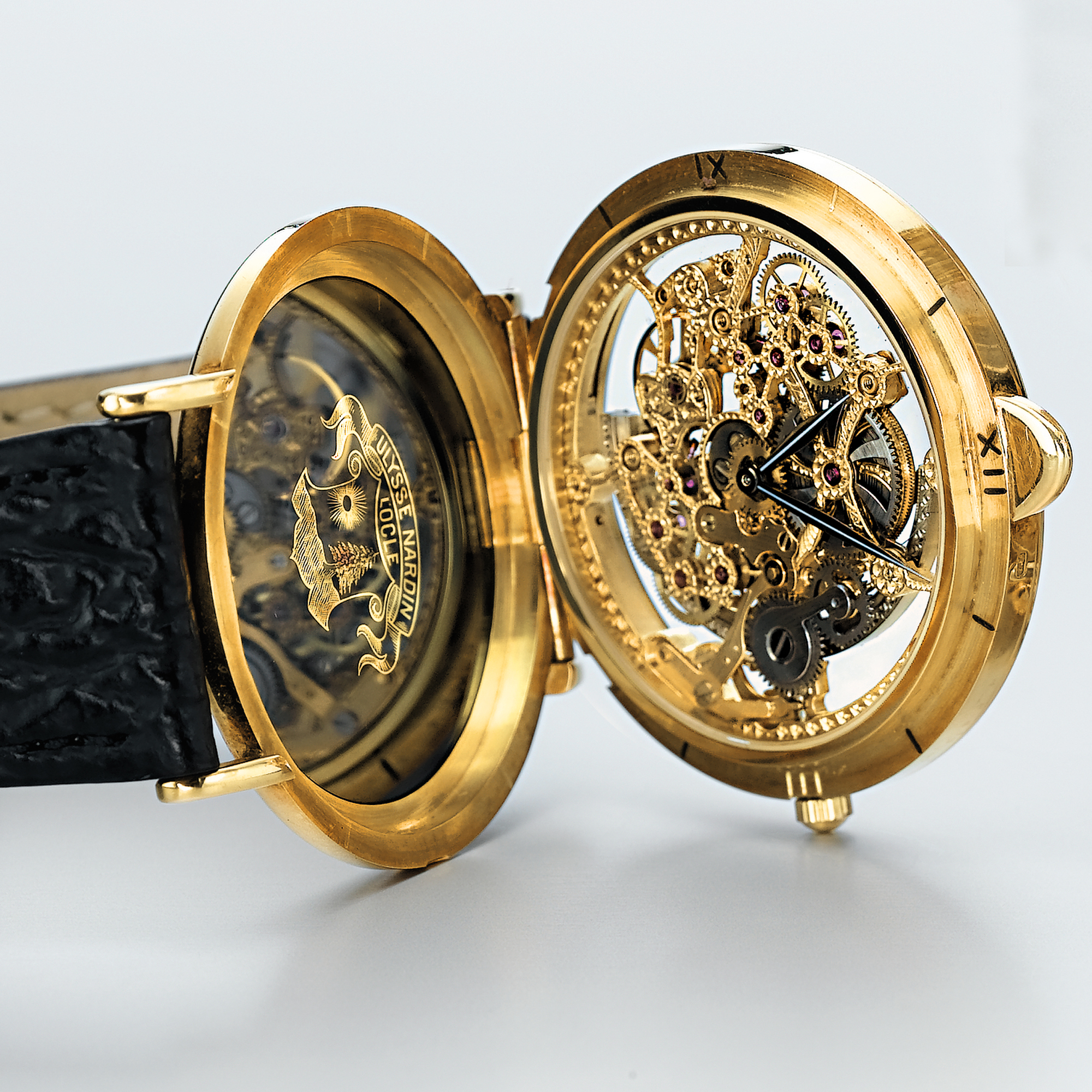 ULYSSE NARDIN, A RARE AND UNUSUAL GOLD AUTOMATIC SKELETONISED WRISTWATCH CIRCA 1990