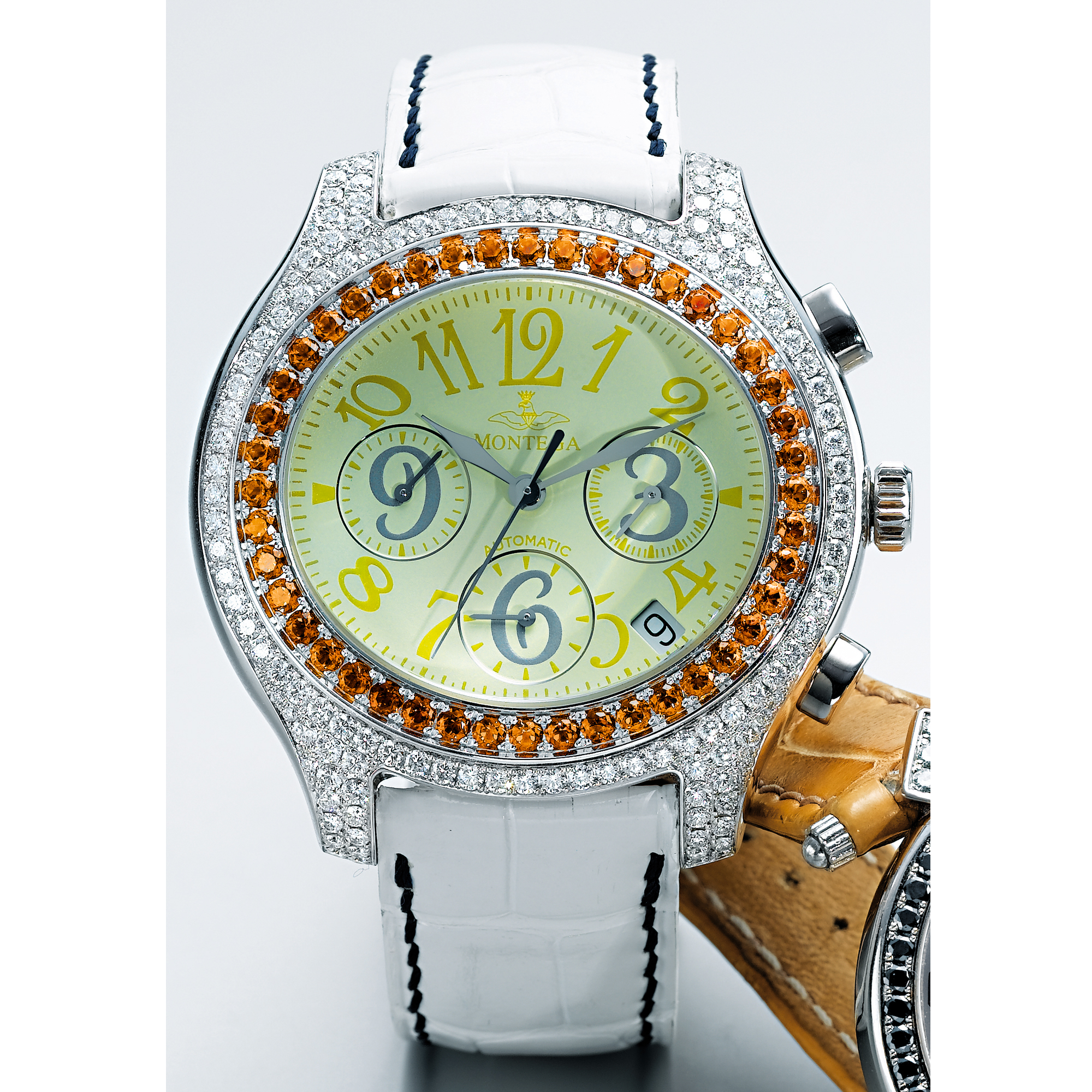 MONTEGA, A LADY'S WHITE GOLD, DIAMOND AND COLOURED SAPPHIRE SET OVAL AUTOMATIC CHRONOGRAPH WRISTWATCHCIRCA 2006
