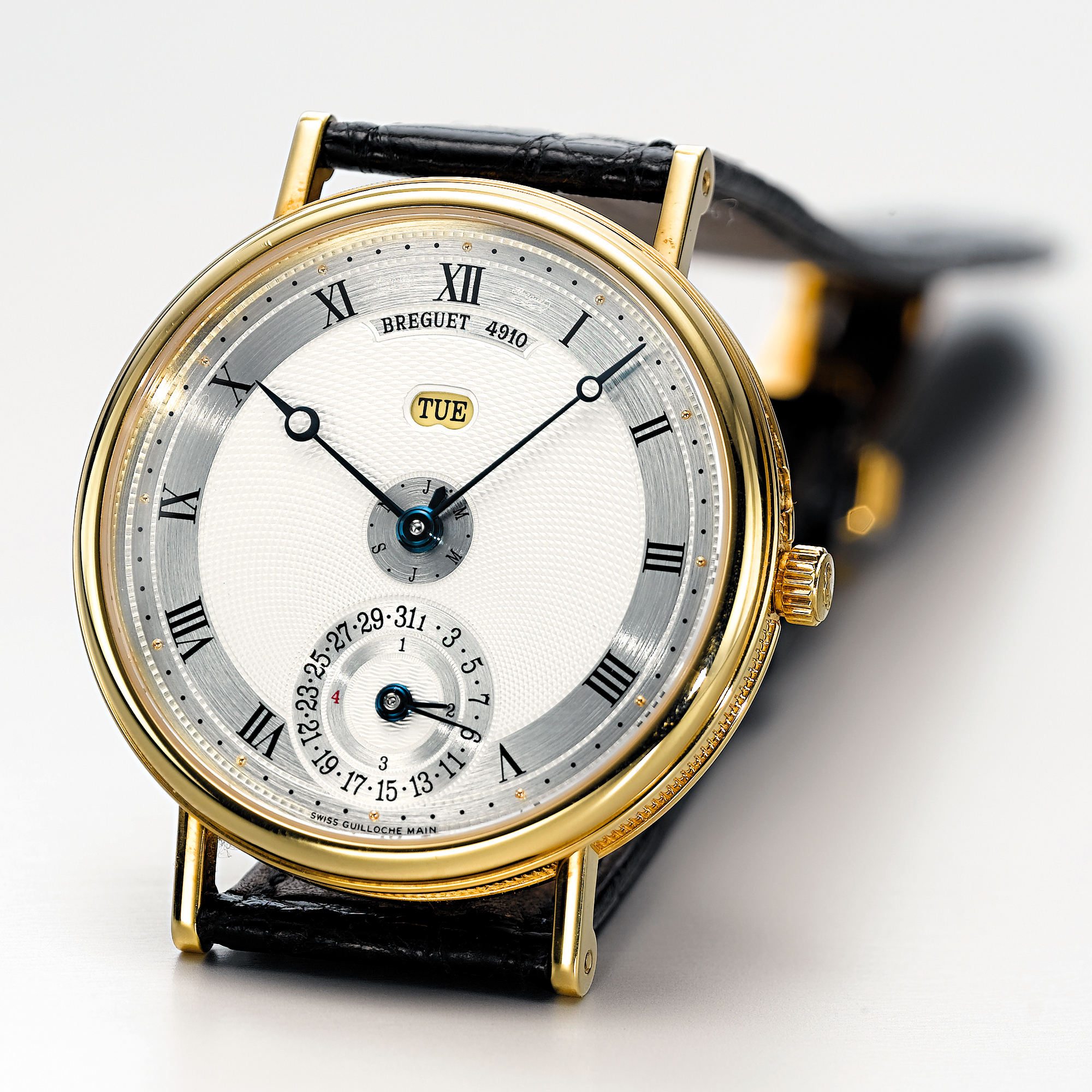 Breguet, A FINE GOLD PERPETUAL CALENDAR WRISTWATCH WITH VERTICAL CALENDAR CIRCA 2000 REF 7707 NO 4910J
