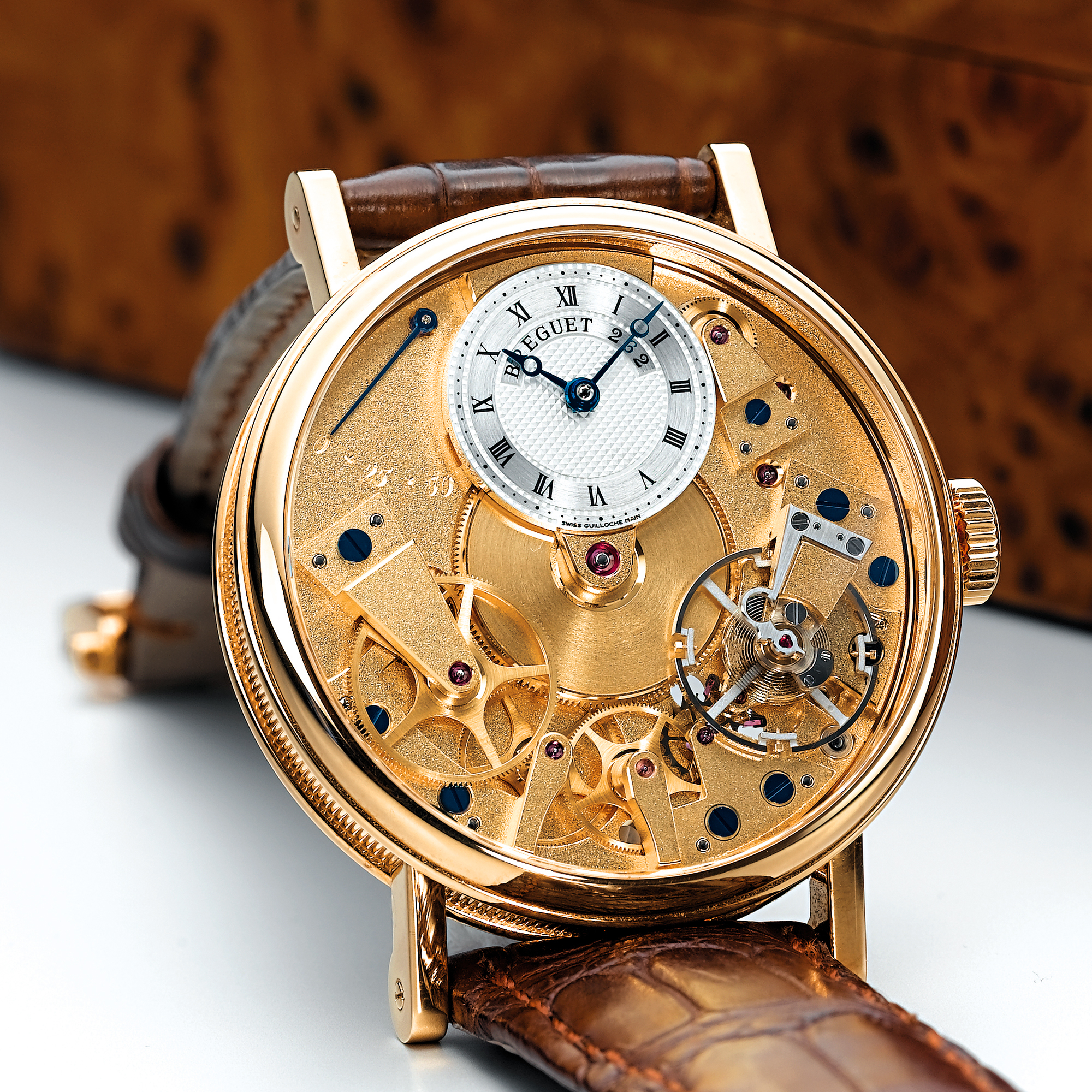Breguet, A FINE GOLD SEMI-SKELETONISED WRISTWATCH WITH POWER RESERVE CIRCA 2005 REF 7027 LA TRADITION NO 262